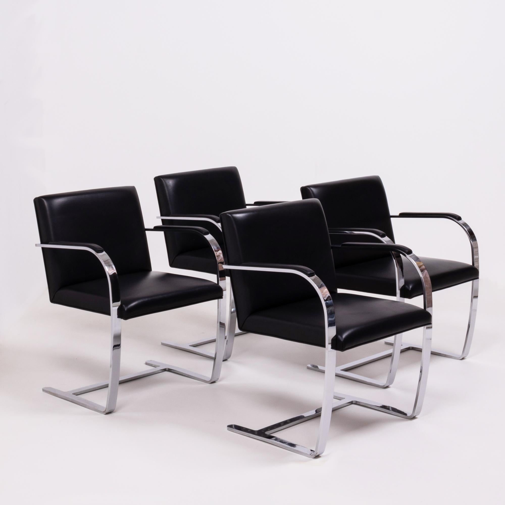 Originally designed by Mies van der Rohe in 1930 for his House in Brno, Czech Republic, the Brno chair remains a design icon.

Sleek and simple, this set of four chairs are upholstered in black leather and feature slim chrome frames with curved