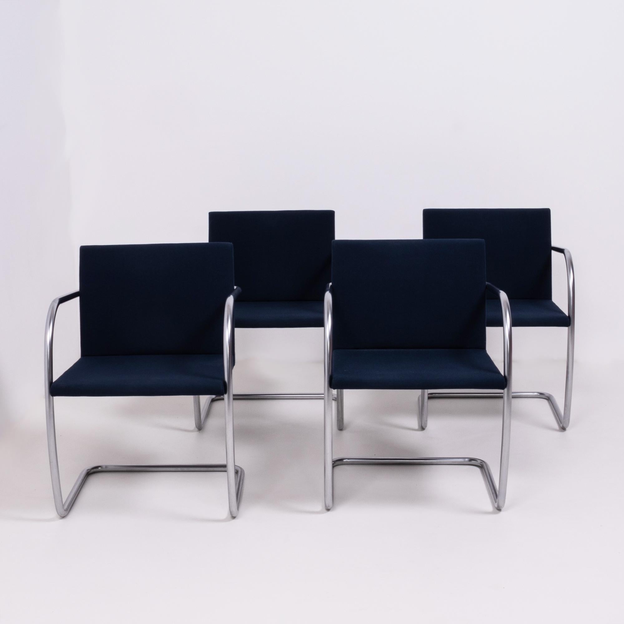 Originally designed by Mies van der Rohe in 1930 for his house in Brno, Czech Republic, the Brno chair remains a design icon.

Sleek and simple, this set of four cantilever chairs are upholstered in navy fabric and feature tubular chrome frames