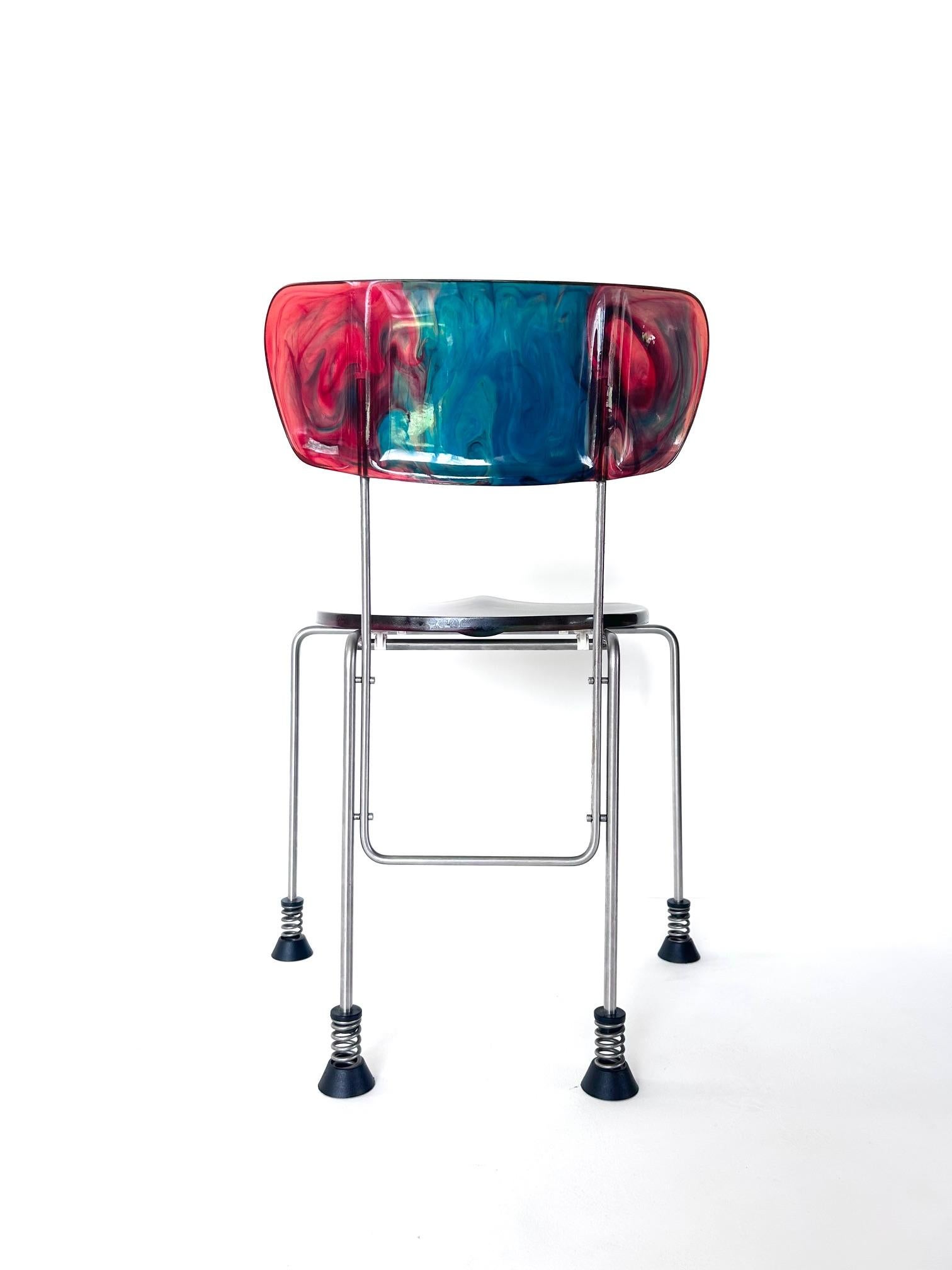 Broadway chair, Gaetano Pesce, Bernini, 1993

Gaetano Pesce ‘Broadway’ chair produced by Bernini with four rubber-capped feet standing on springs. 
Model 543, created in 1993 for Bernini
Epoxy resin back and seat
Stainless steel structure