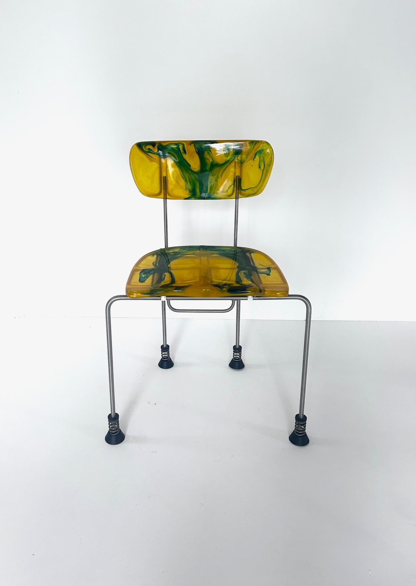 Broadway chair, Gaetano Pesce, Bernini, 1993

Gaetano Pesce ‘Broadway’ chair produced by Bernini with four rubber-capped feet standing on springs. 
Model 543, created in 1993 for Bernini
Epoxy resin back and seat
Stainless steel structure