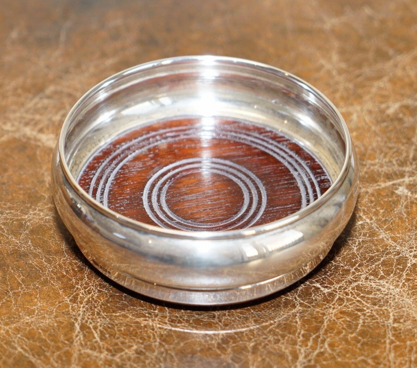 Wimbledon-Furniture 

Wimbledon-Furniture is delighted to offer for sale this lovely Broadway Silver 1987 Sterling silver wine or Champagne coaster. 

A very good looking well-made piece with a solid mahogany base, the bottom is green felt covered,