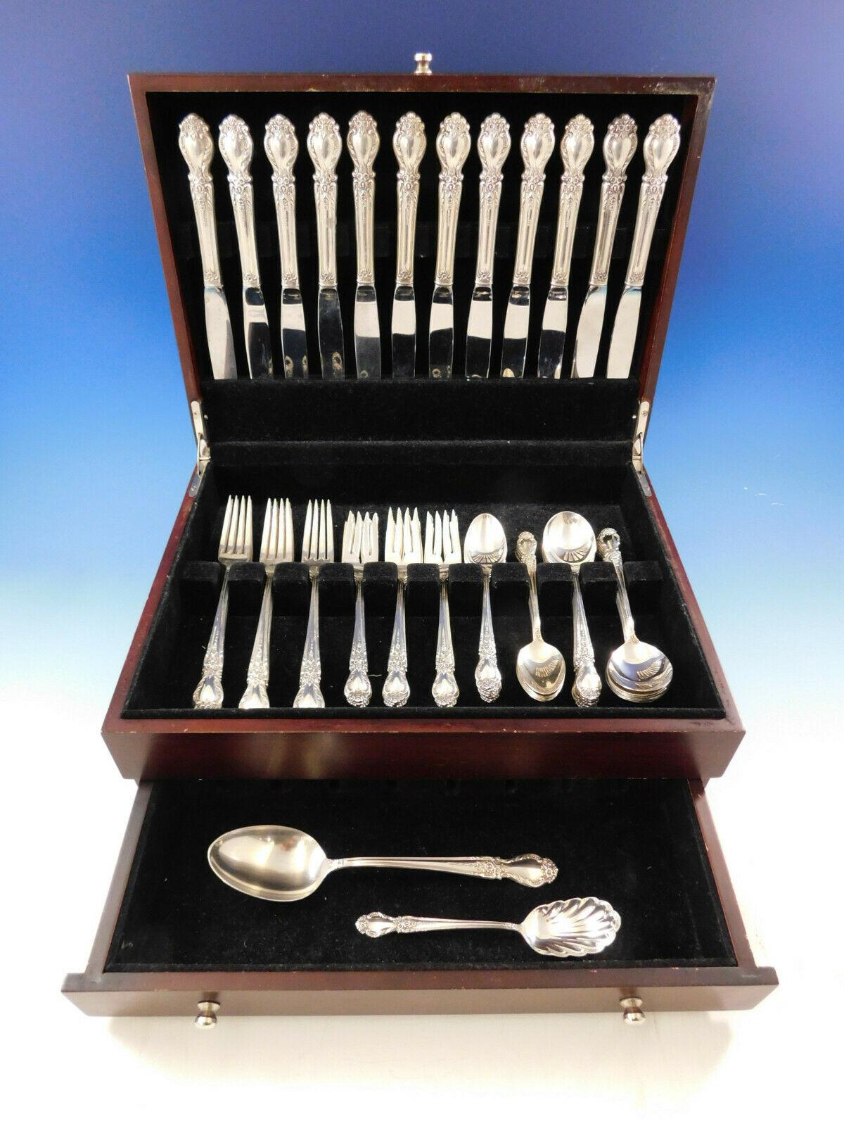 Dinner Size Brocade by International sterling silver flatware set of 62 pieces. This set includes:

12 dinner size knives, 9 1/2
