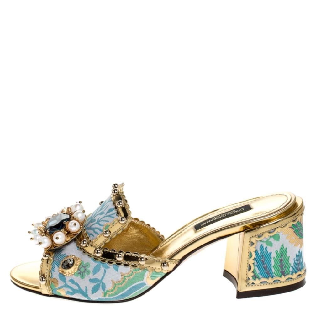 Flaunt these fabulous sandals from Dolce & Gabbana and step out in style. These sandals will make you look confident and stylish. Crafted from luxurious brocade fabric and patent leather, they come in striking multicolored hues. The uppers are