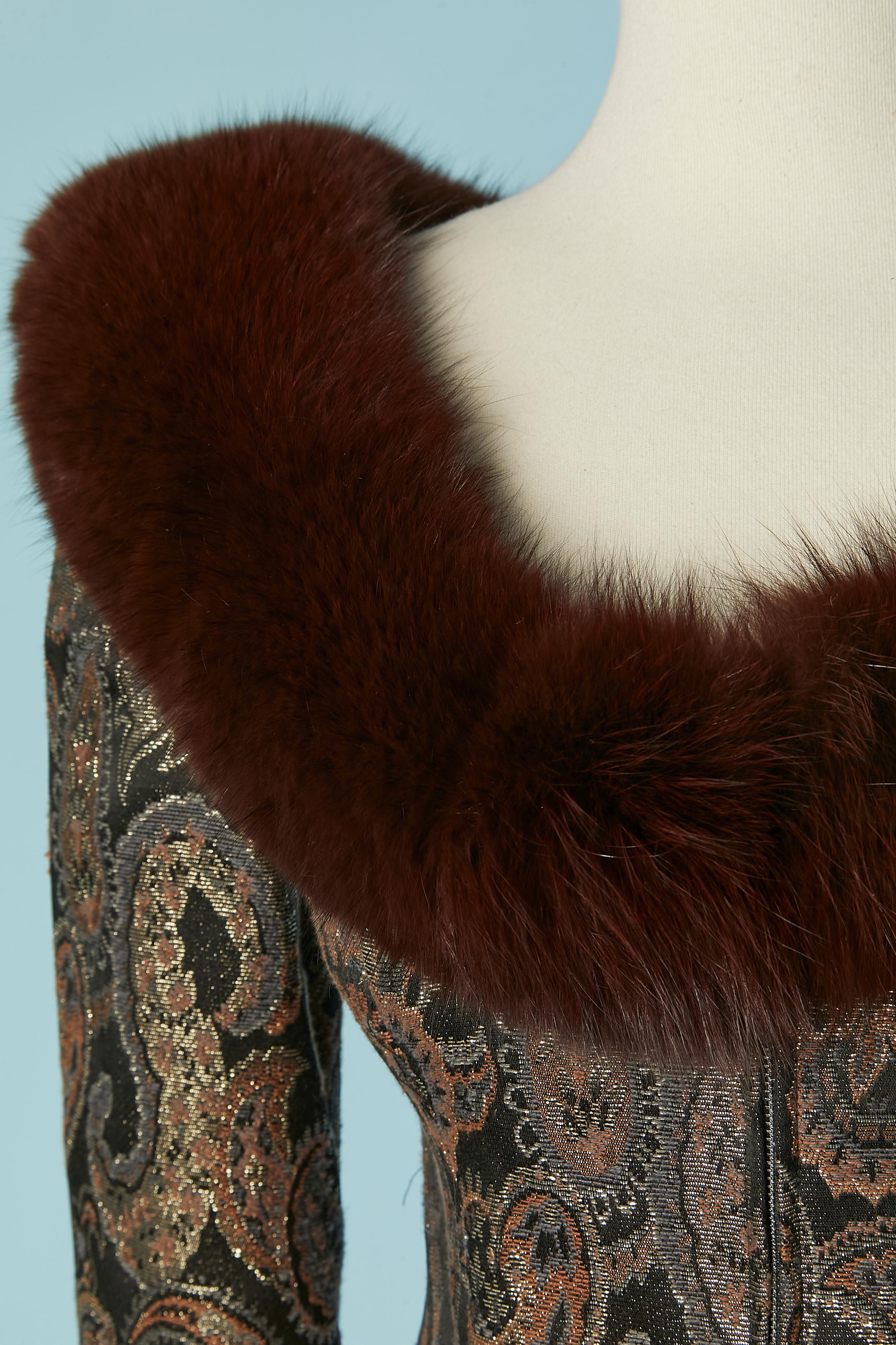 Brocade skirt suit with fur edge on the jacket and padded skirt . Main fabric composition: 48% cotton, 47% acetate, 5% metal. No indication for the lining composition but it's probably rayon. Zip closure on the middle front. 
SIZE of the jacket : S