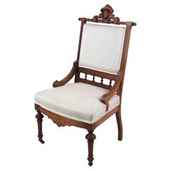 Brocade-Upholstered Eastlake Parlor Chair with Casters