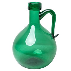Jarra de vidrio verde, años 50