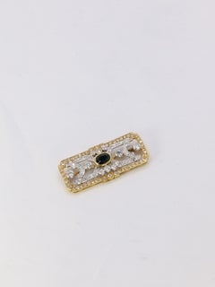 Gold plate brooch with diamonds and oval sapphire