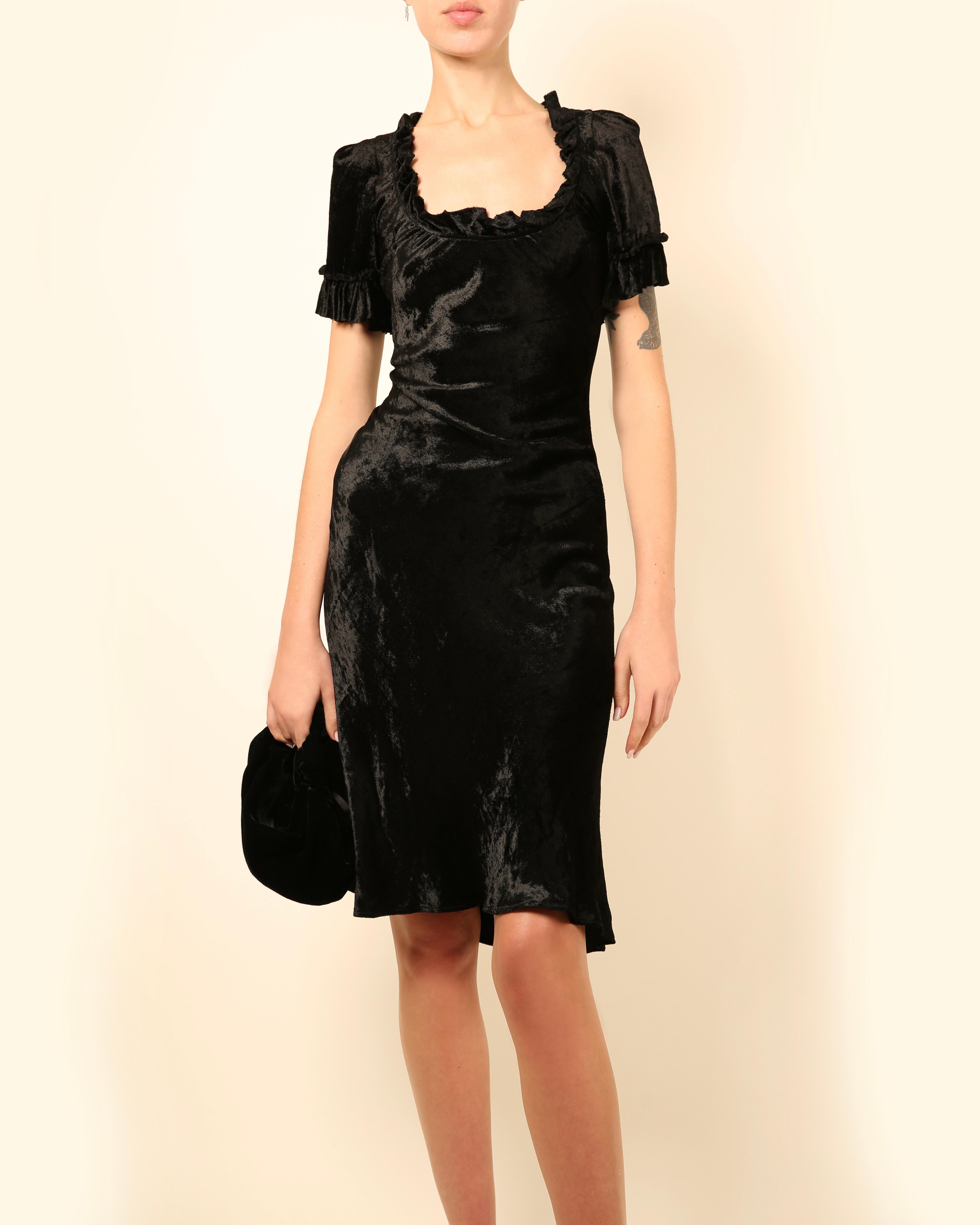 LOVE LALI Vintage

Brock Collection black velvet dress
Square neckline
Short sleeves
Ruffle detail to the neck and sleeves
Knee length
Fitted body with a slight flare to the skirt
No zip

Size:
US 4 - however I believe this has been altered to fit