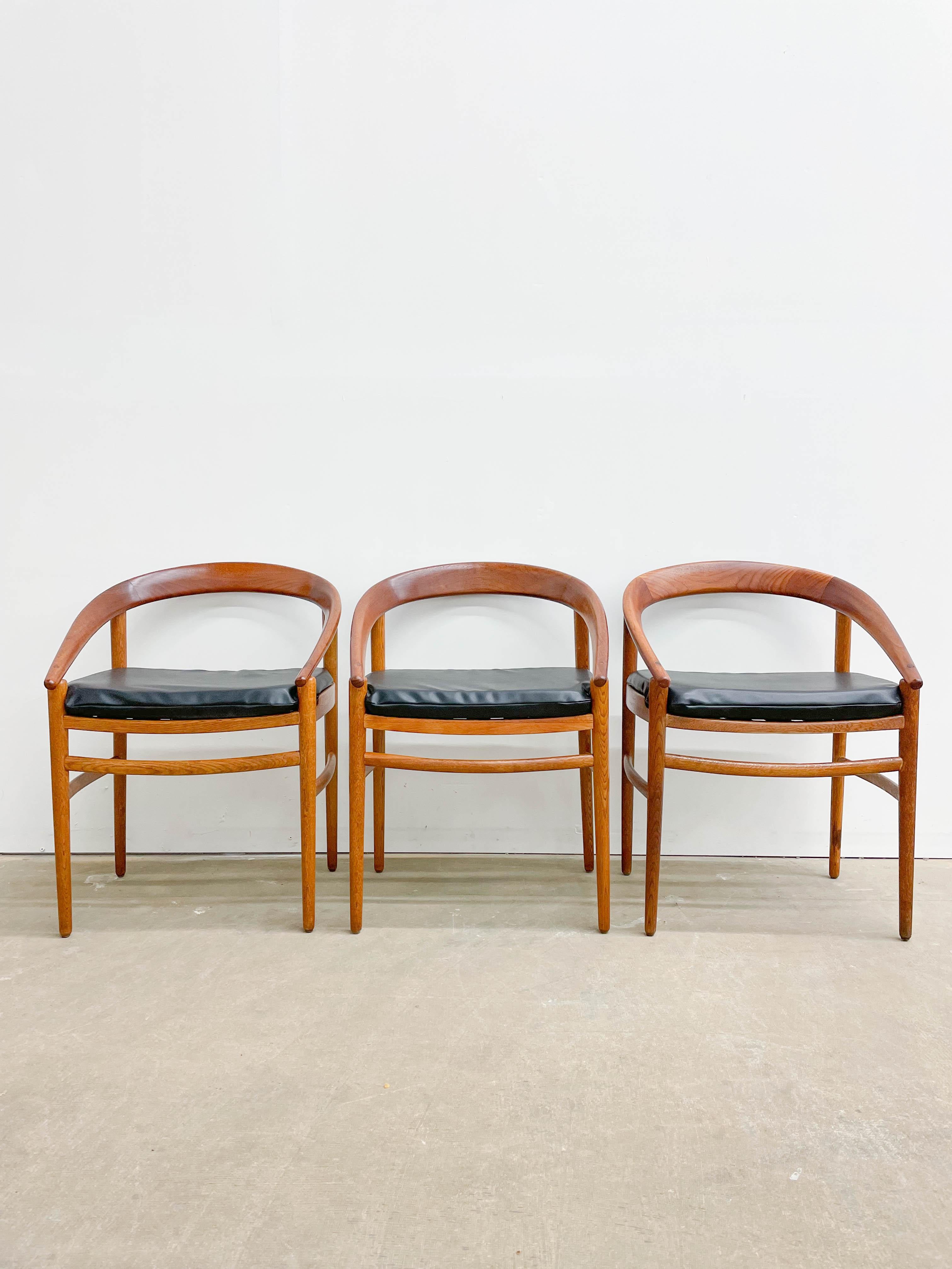 Early production dining chairs designed by H. Brockmann-Petersen and made by P. Jeppesens in Denmark in the 1950s. These three mid-century modern chairs offer solid oak frames with design that is slight and refined. To contrast the oak beautifully,