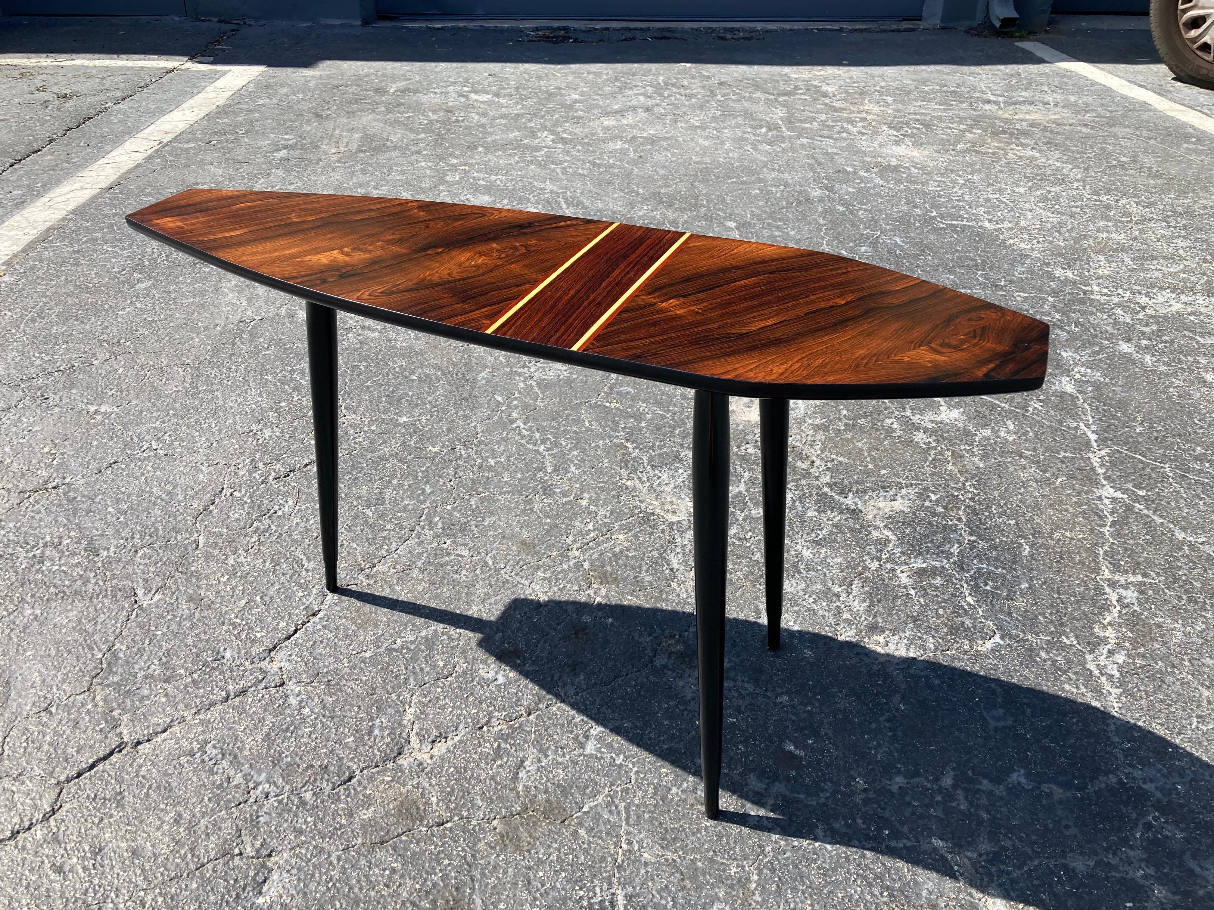 Beautiful side table made by Bröderna Miller in Sweden, most likely from the 1960s. The three black legs unscrew. Table top in rosewood and other veneer. Please see pictures. Ready for a new home.