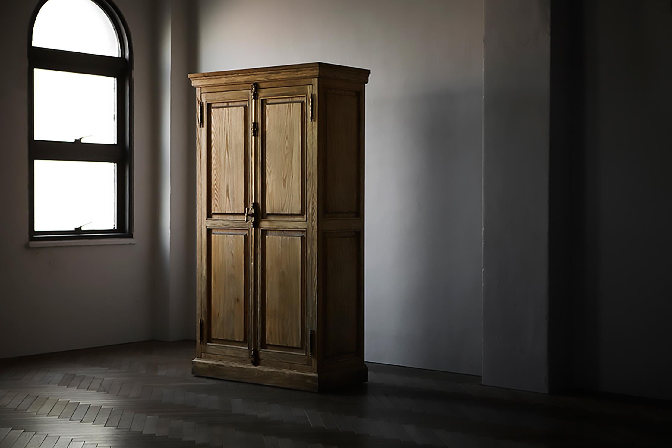 An authentic cabinet with a functional beauty. The cabinet is a classic piece of furniture, with a refined decoration that adds a touch of luxury to any room. The detailing of the metalwork accentuates the quality of the wood and gives the cabinet a