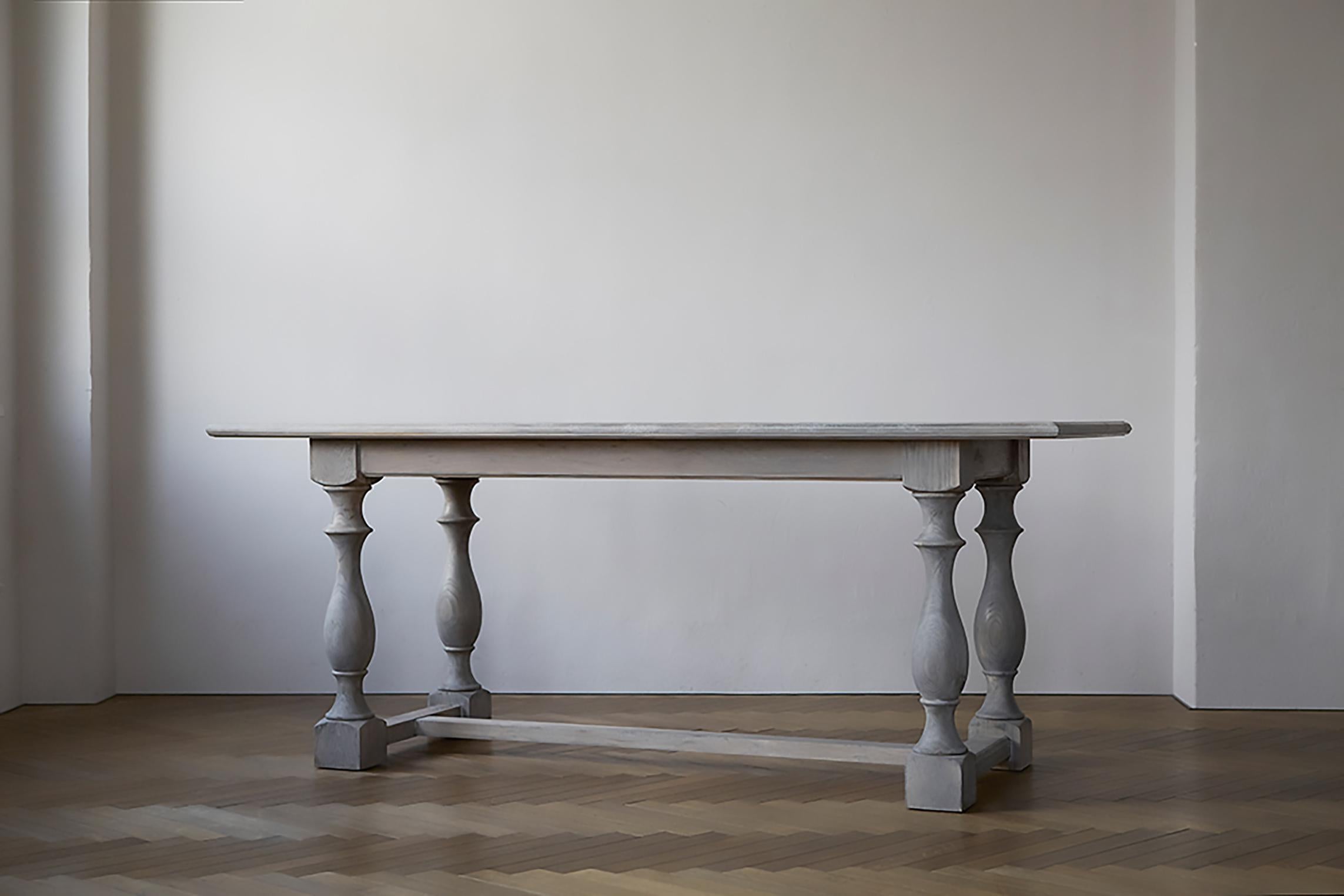 Inspired by a 17th century French abbey table, this dining table has been redesigned to fit in with modern shops and homes. The table is made of solid wood and the curved legs are carefully carved by a wheelwright to give it a classical