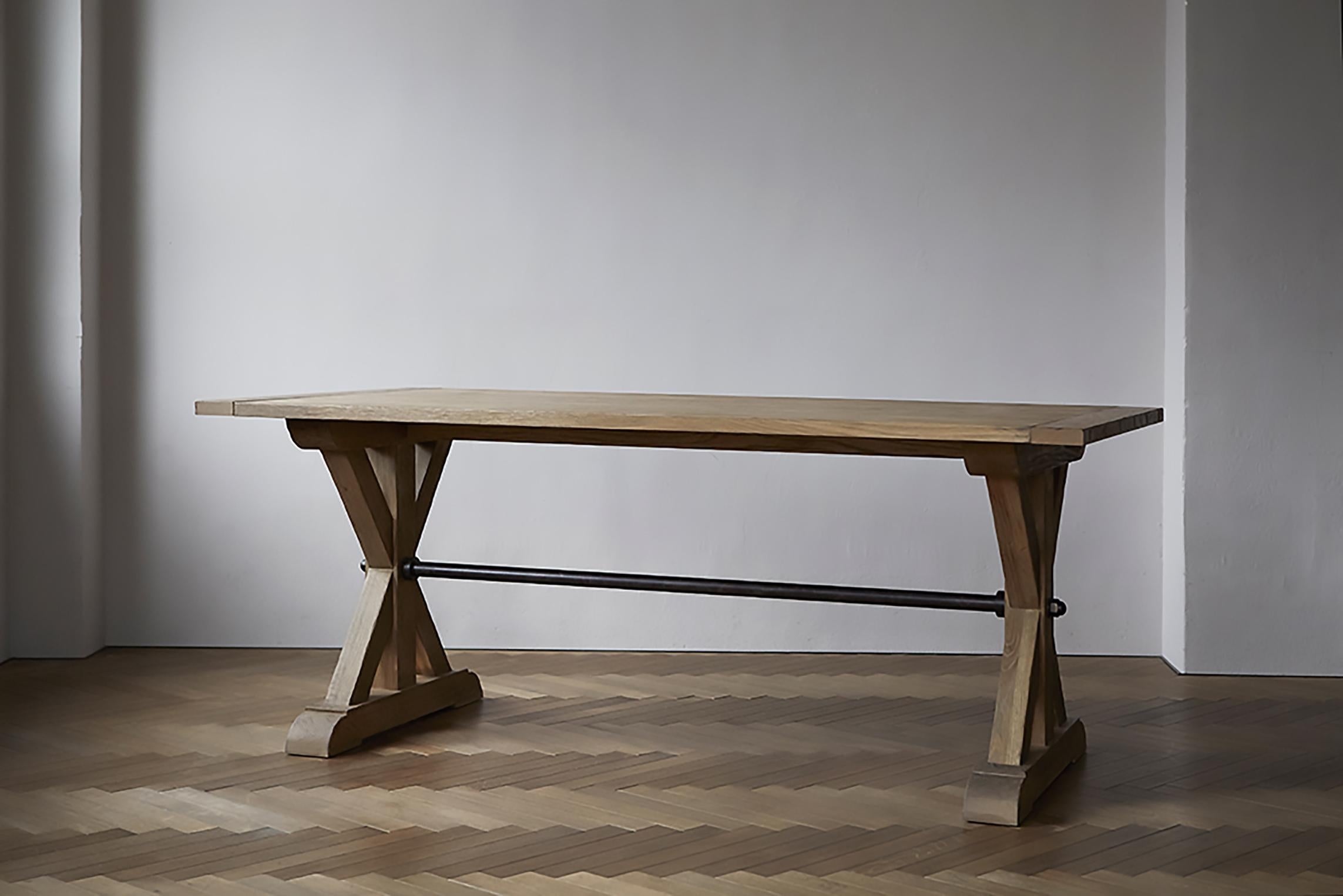 Brodia truss table

A massive table with thick solid wood legs that intersect. The legs are connected by iron poles, which give the table a strong and rugged appearance. The hexagonal bolts at each end are a subtle accent. Its imposing