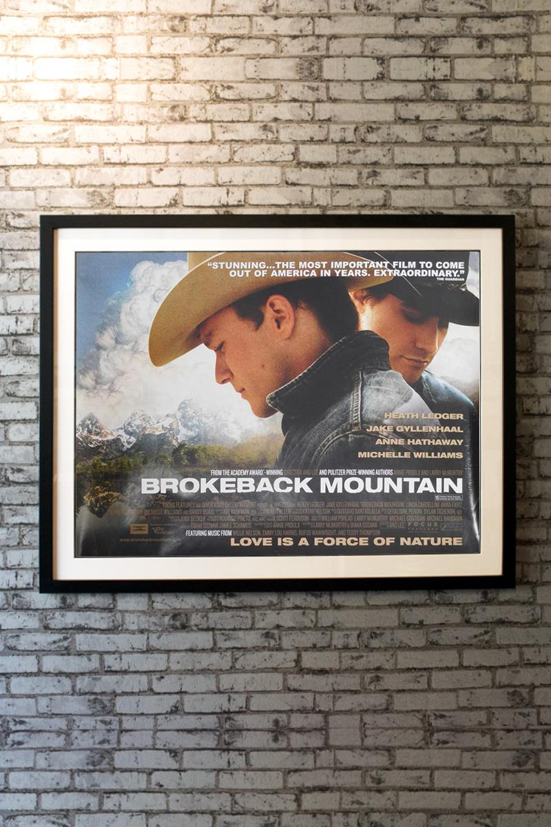 In 1963, rodeo cowboy Jack Twist (Jake Gyllenhaal) and ranch hand Ennis Del Mar (Heath Ledger) are hired by rancher Joe Aguirre (Randy Quaid) as sheep herders in Wyoming. One night on Brokeback Mountain, Jack makes a drunken pass at Ennis that is