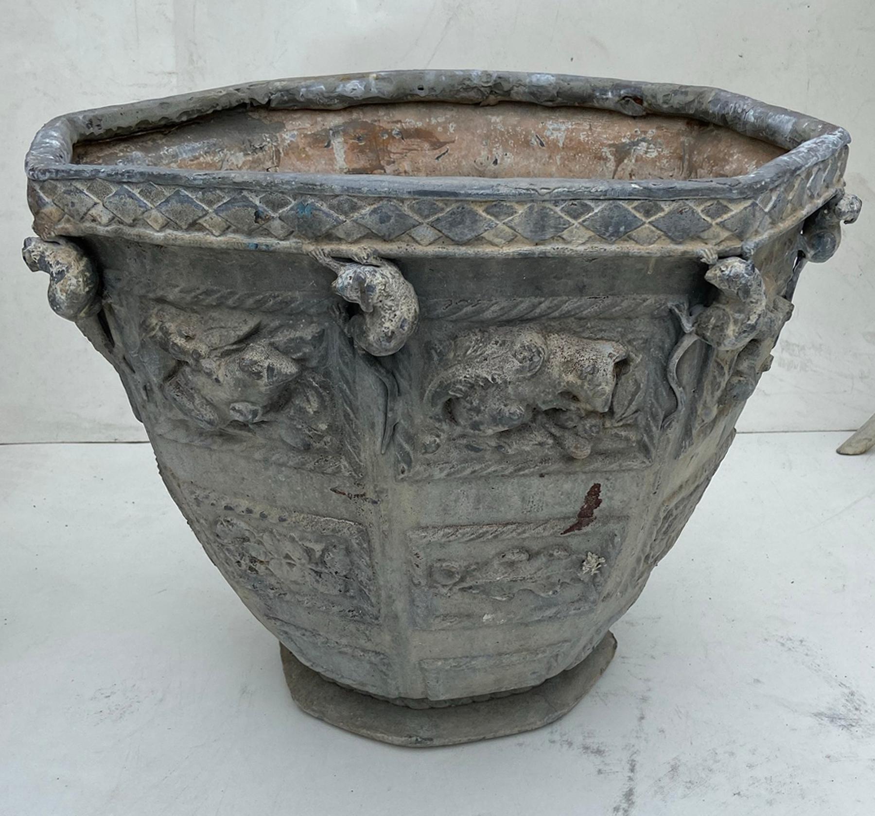 Extremely rare pair of “Bromsgrove Guild of Applied Arts” lead planters, circa 1910 Founded by Walter Gilbert. The guild received a Royal warrant in 1908. Among its many works are the gates at Buckingham palace. Cast in lead with 8 equal sides.