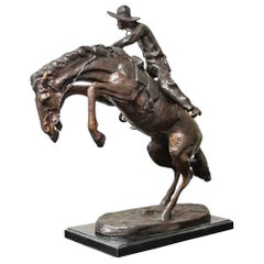 Bronco Buster Bronze Sculpture on Marble Base, after Frederic Remington