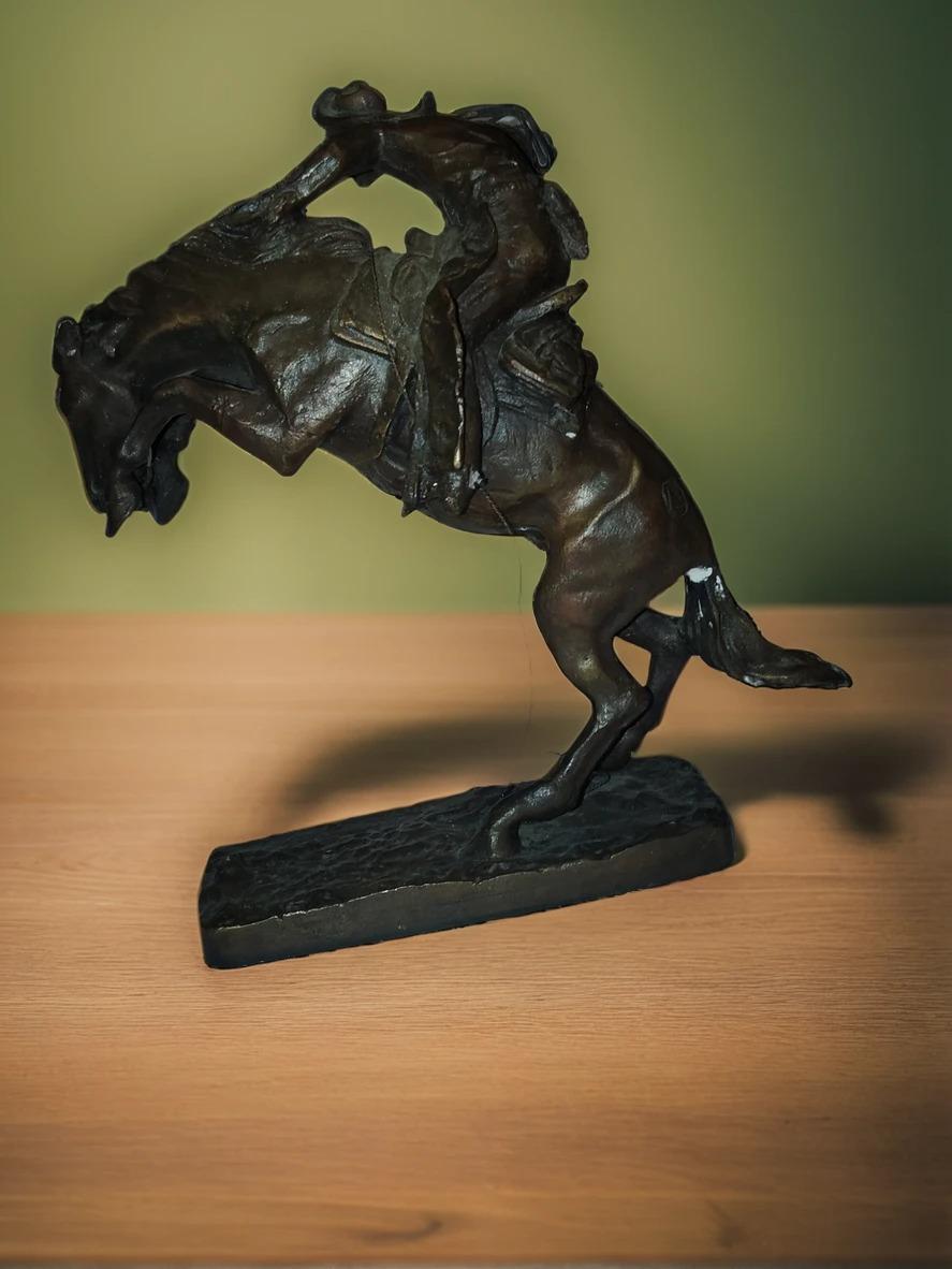 This is a circa 1940's second casting of the iconic bronze by Frederick Remington, entitled 