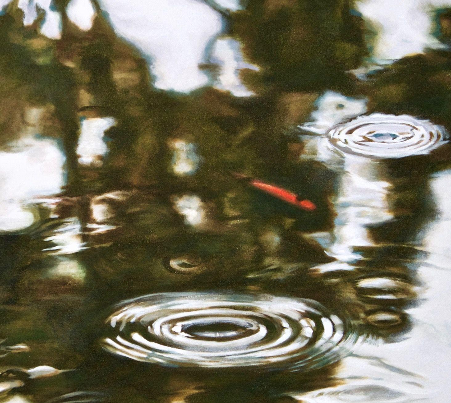 Rain falling on a pond, with a eucalyptus tree reflected in the water's surface. The edges of the reflections morph and move with the disturbance of the raindrops. A small koi fish surfaces. Though rendered realistically, the design and focus are