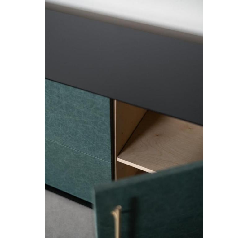 The Bronson Credenza is handmade locally in Los Angeles, California. The unique design of the piece draws its original aesthetic through the combination of classic metal casing and the refined leather doors. The industrial steel casing, a staple of
