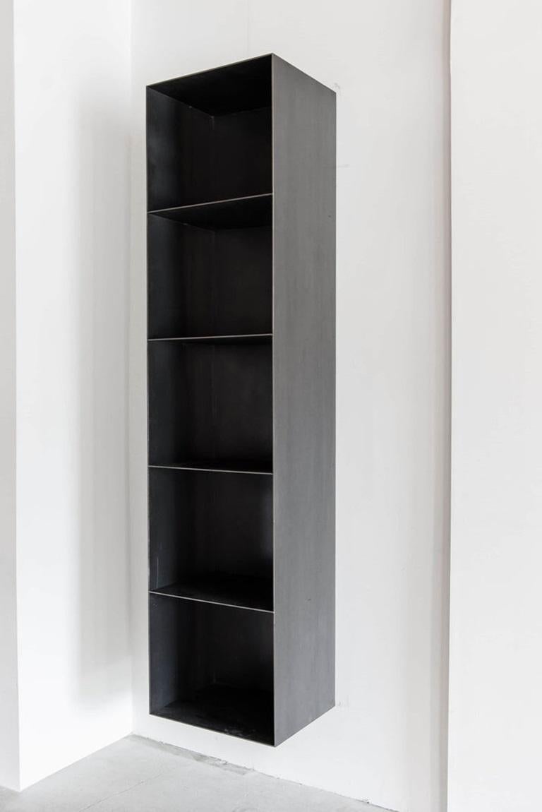 This bookcase is custom made in Los Angeles. The industrial sheet metal is sheered and welded.
INDUSTRIAL STEEL, POLY FINISH
CUSTOMIZE THIS PIECE

For all furniture, protection from heat and moisture is crucial to the longevity of the piece. To help