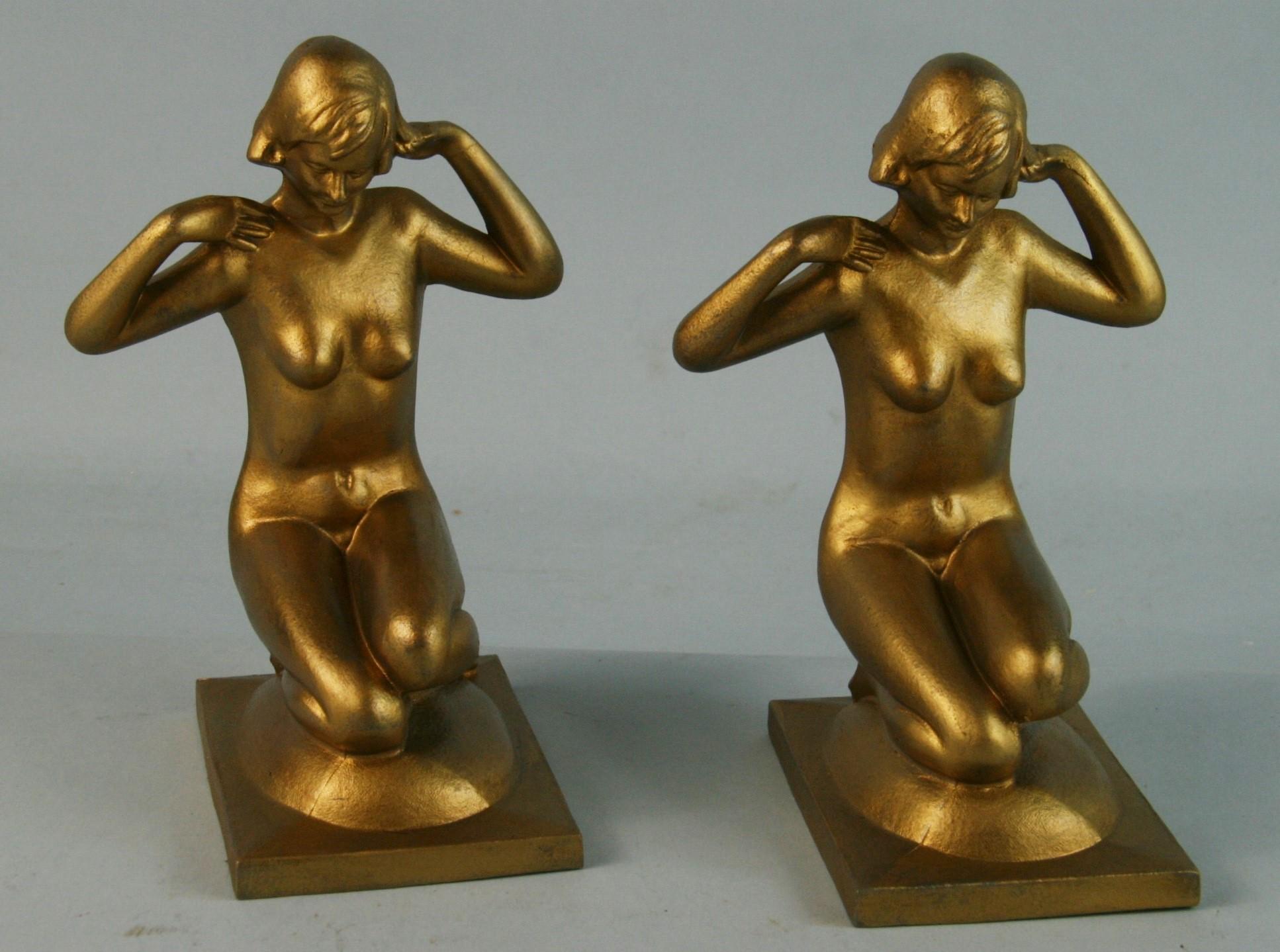 3-669 Bronzart cast metal gilt finished nude female figure bookends.