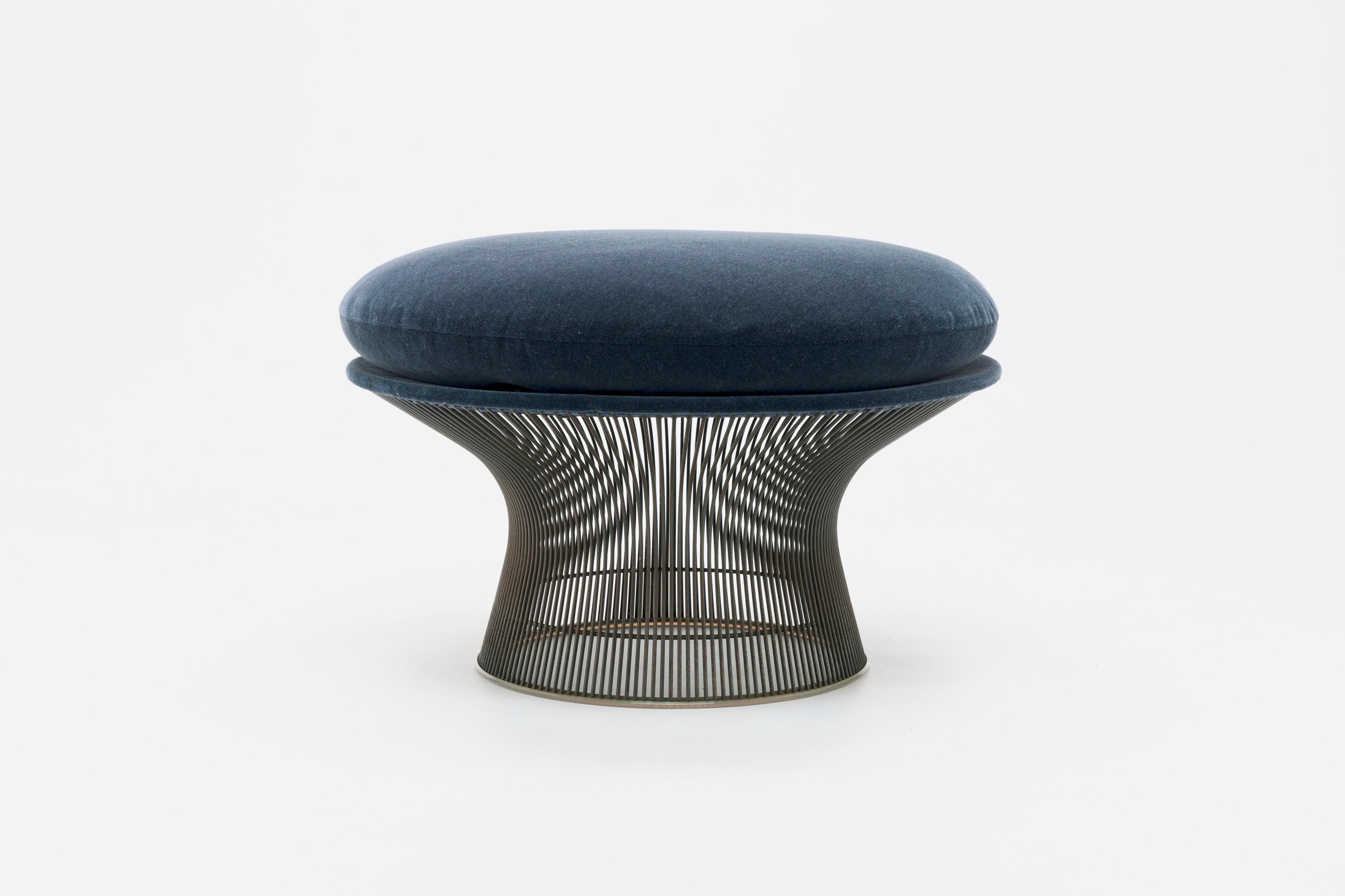 Bronze Warren Platner ottoman from the 1970s upholstered in a Knoll 'Velvet' (Mohair) upholstery.
In the 1960s, American designer Warren Platner transformed steel wire into a sculptural furniture collection, creating what is now considered a design