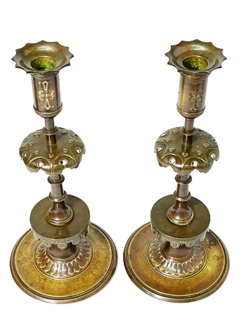 Bronze 19th century Gothic style candleholders

Two bronze candleholders in beautiful bronze patina

Measurements are 30 cm high and 13 cm diagonal
The weight in total is 2020 gram.