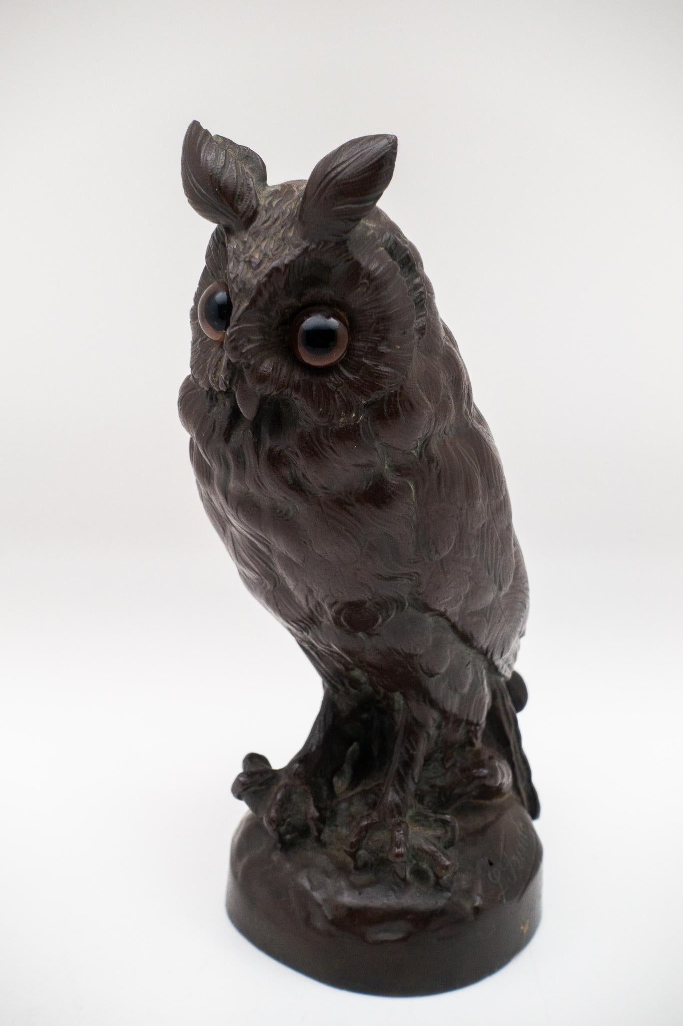 Bronze 19th century sculpture of perched owl fitted with glass eyes, by L. Frouin (signed).