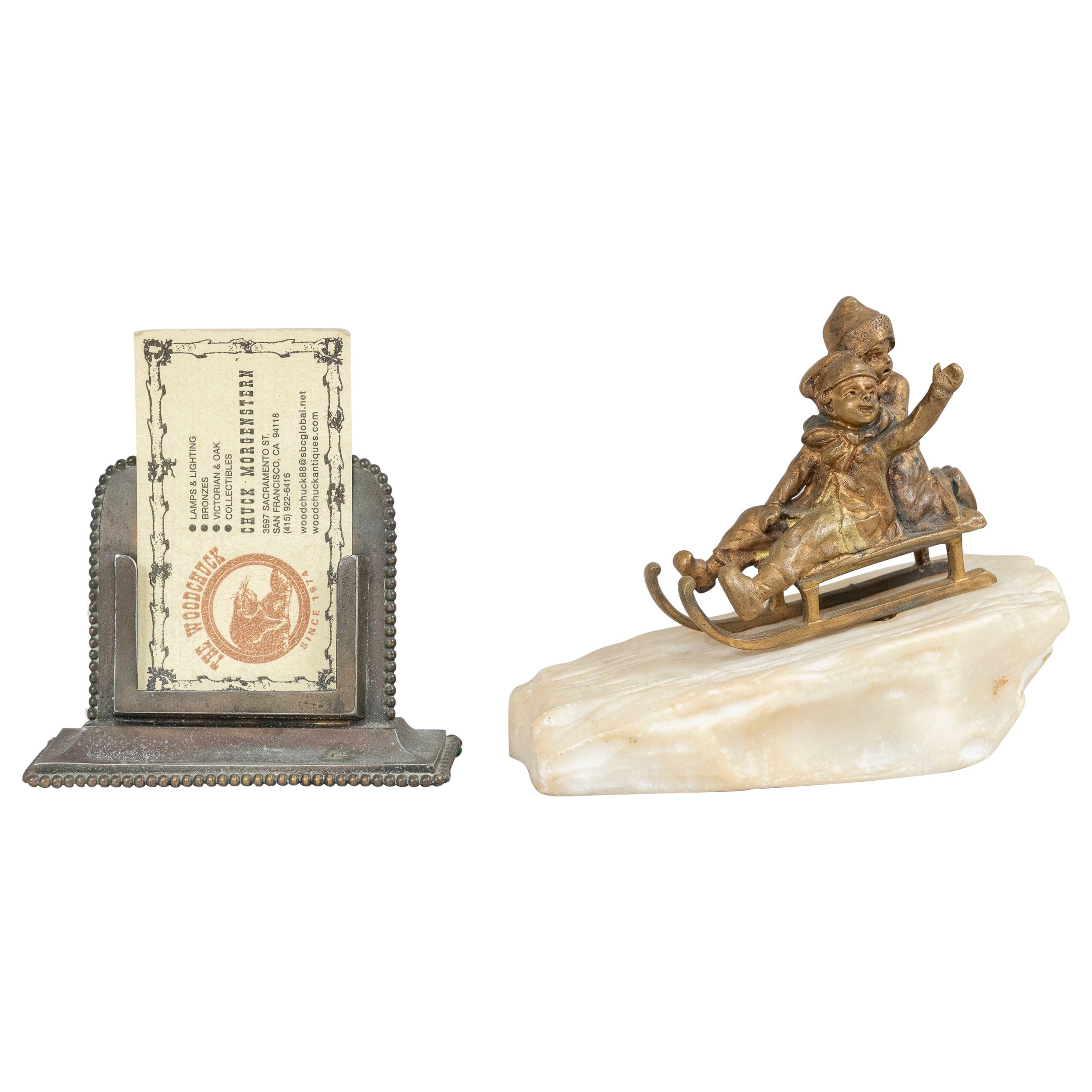 This whimsical little bronze shows 2 young children on a sled riding down a hill of snow and with one youngster waving to us. The bronze is finished in gilt and the sled is mounted on carved marble. That is marble, not alabaster, and if you ever