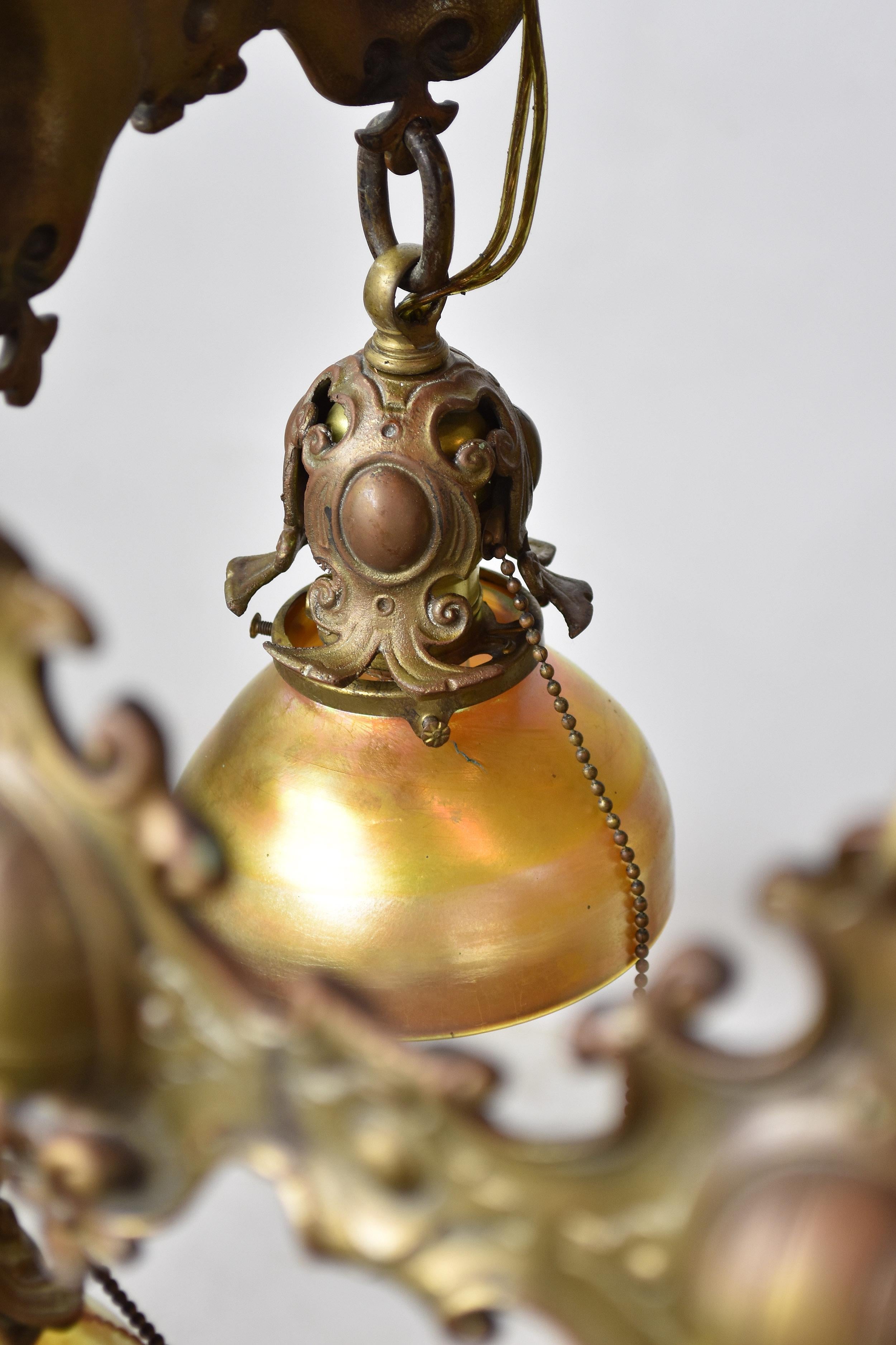 Bronze 7 Shade Chandelier with Tiffany Attributed Aurene Glass In Good Condition For Sale In Minneapolis, MN