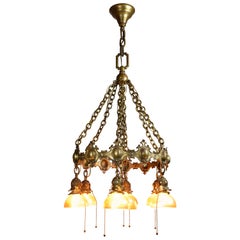 Antique Bronze 7 Shade Chandelier with Tiffany Attributed Aurene Glass