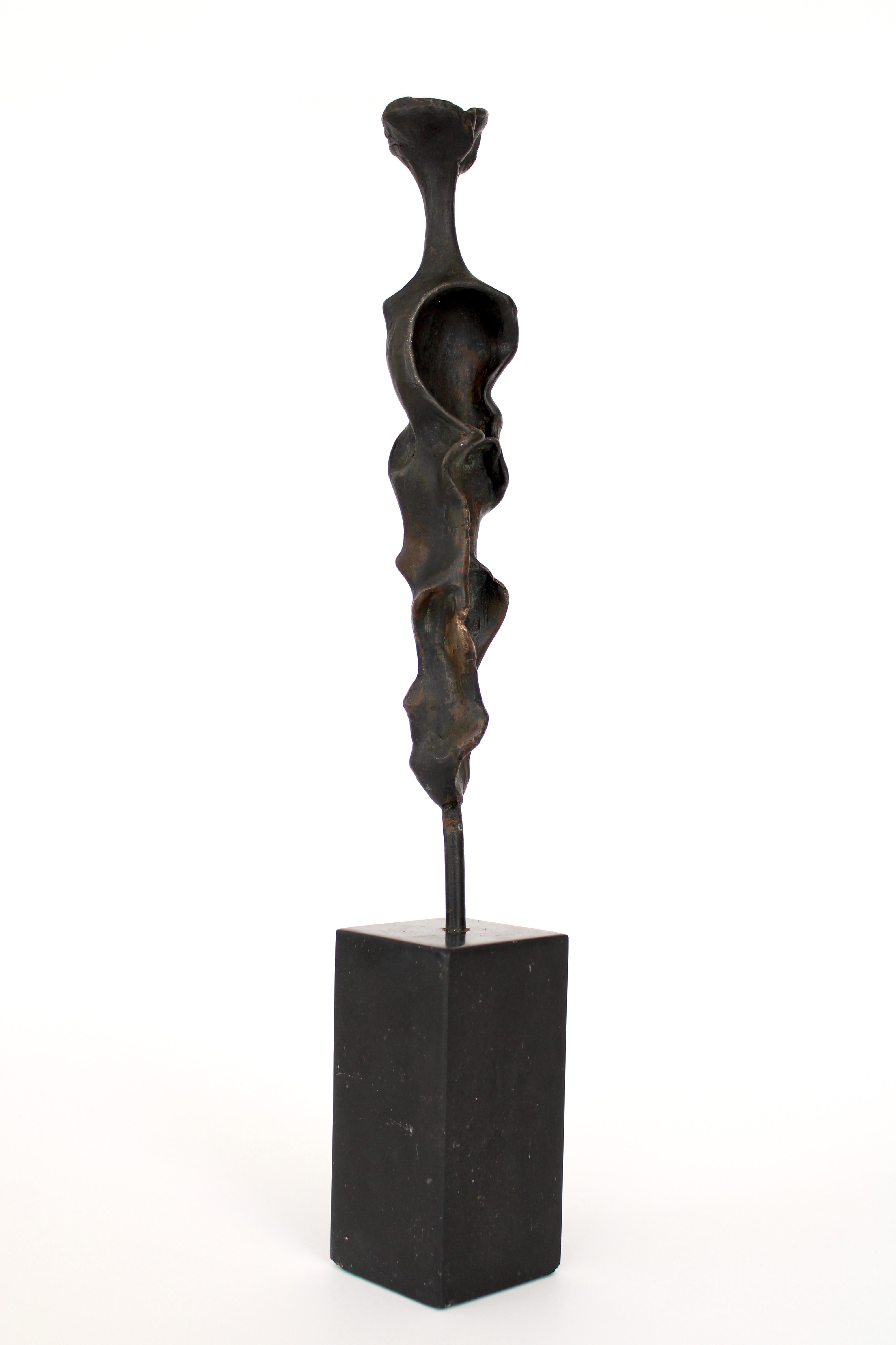 An abstract cast hand formed bronze figurative sculpture. The hand of the artist is quite evident in the molding of the figure. 
American artist but difficult to read the signature. 
On a black marble mount. 
Overall size: 2