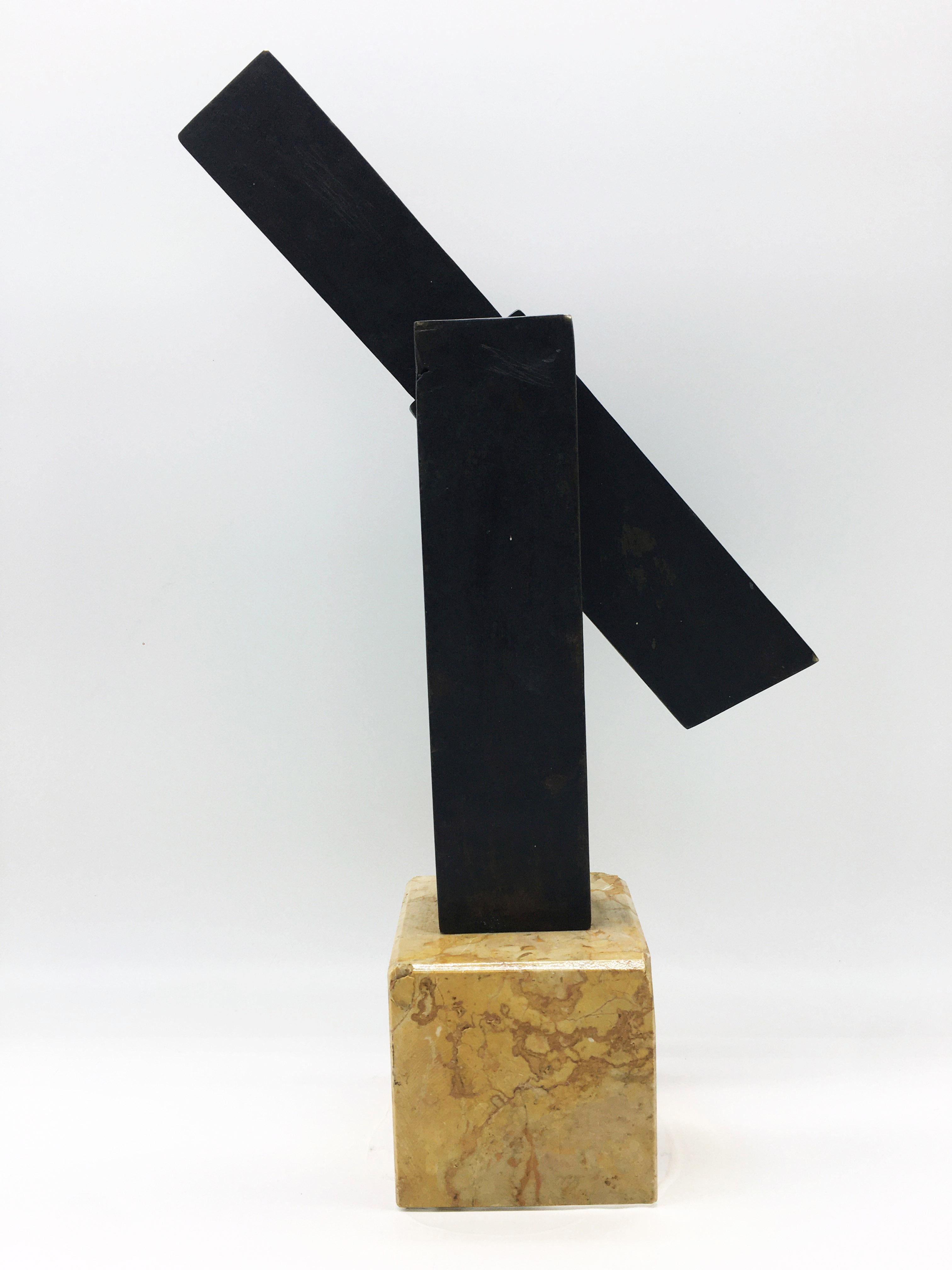 Patinated bronze sculpture on marble base.
The sculpture represents an open desk pen holder, to represent the momentum of culture and human ingenuity as a futurist concept.