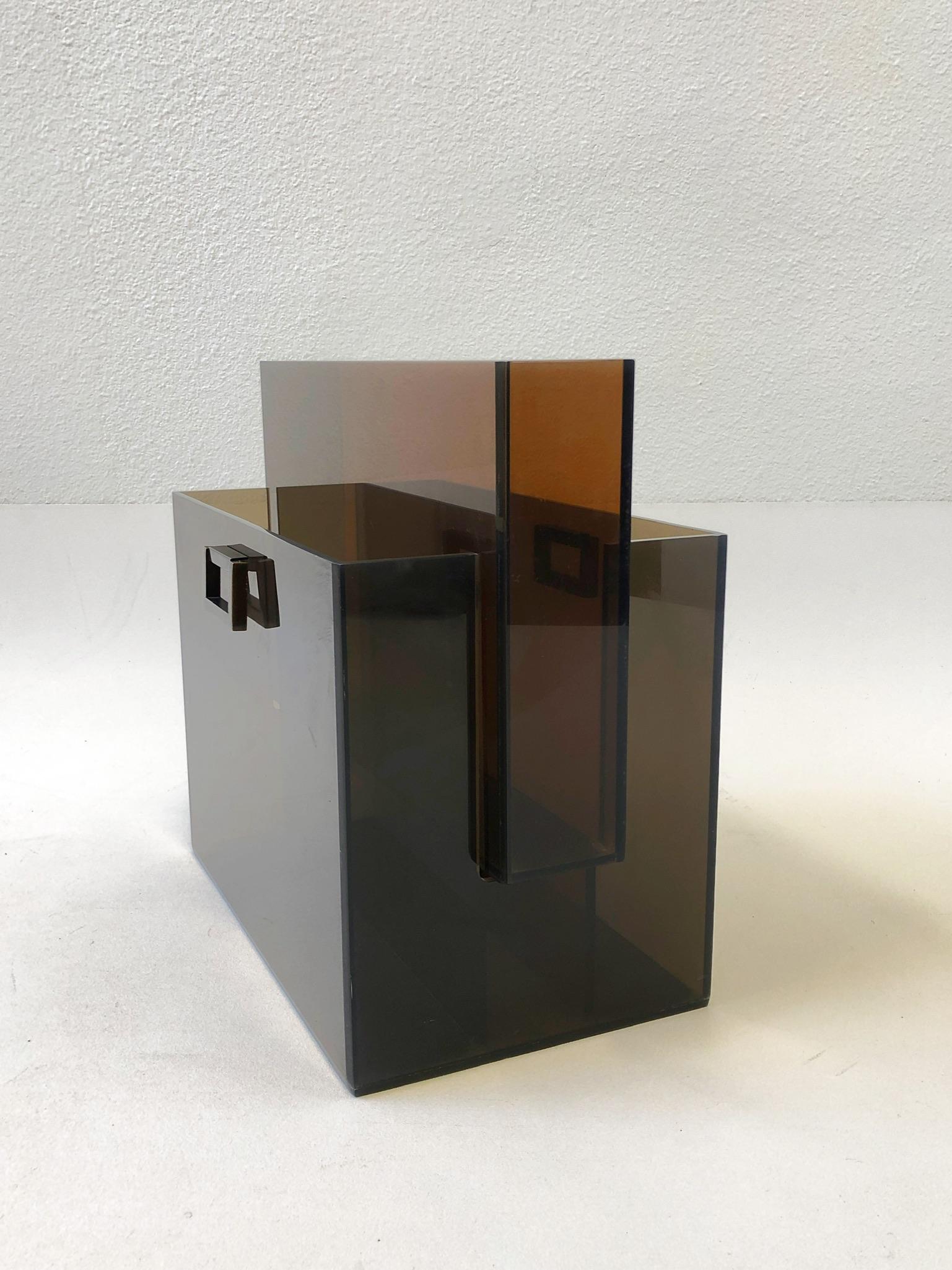 1960’s bronze acrylic “Box Line” magazine holder designed by renowned American designer Charles Hollis Jones. 
Book not included. 
Measurements: 17” wide, 9” deep and 15” high.