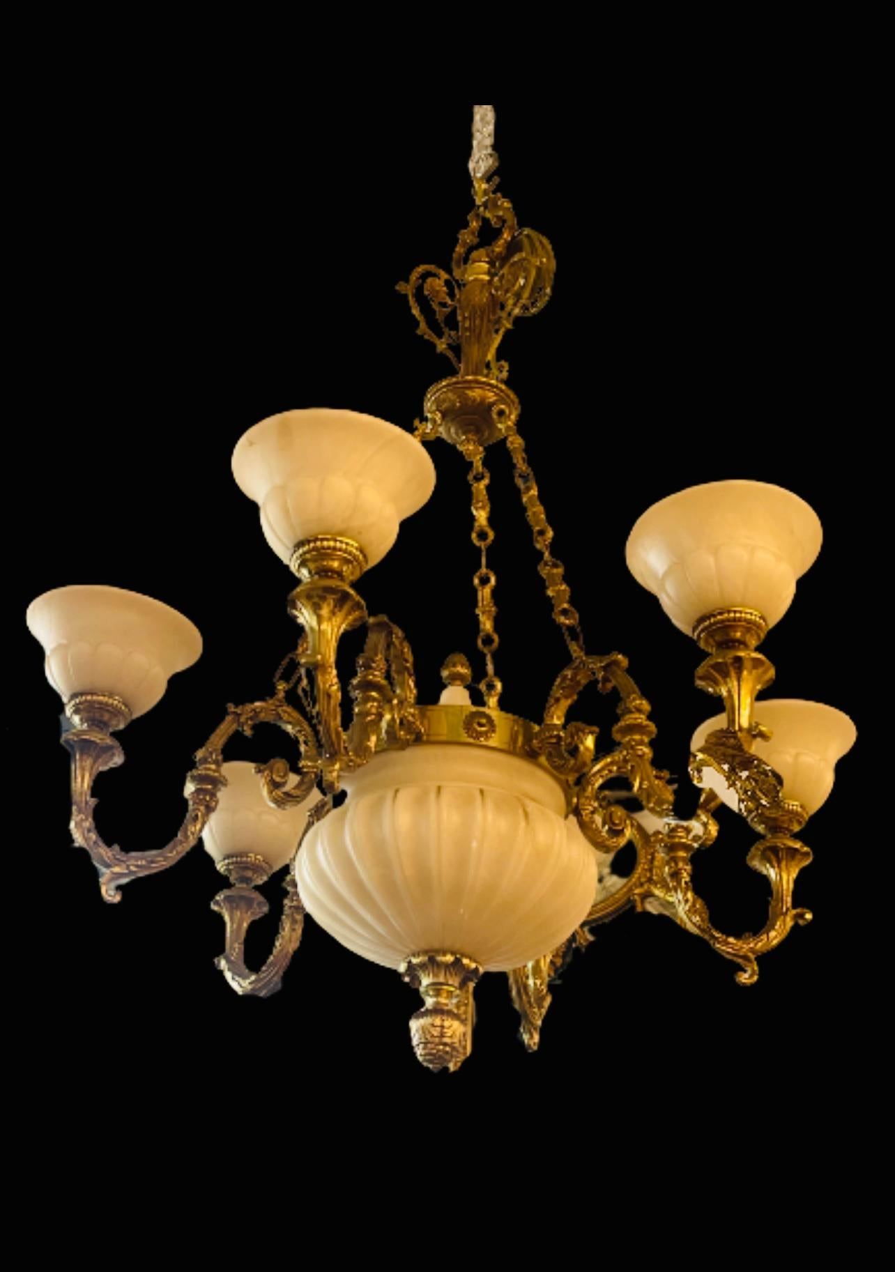 A Victorian cast bronze and alabaster six light chandelier.