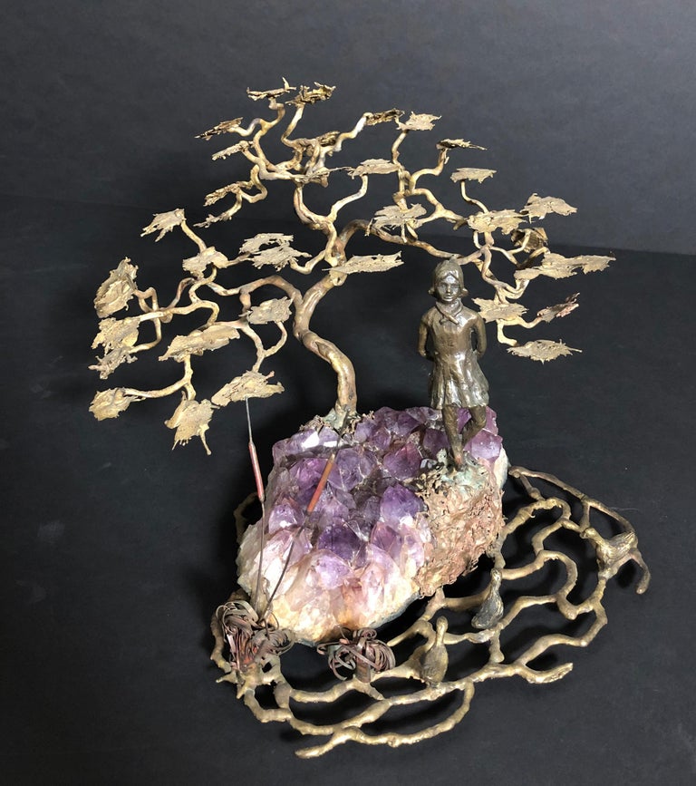 Bronze sculpture of a young girl standing, mounted on a natural amethyst stone ground at the edge of pond with ducks and reeds, covered by a stylized sprawling tree. Unsigned.