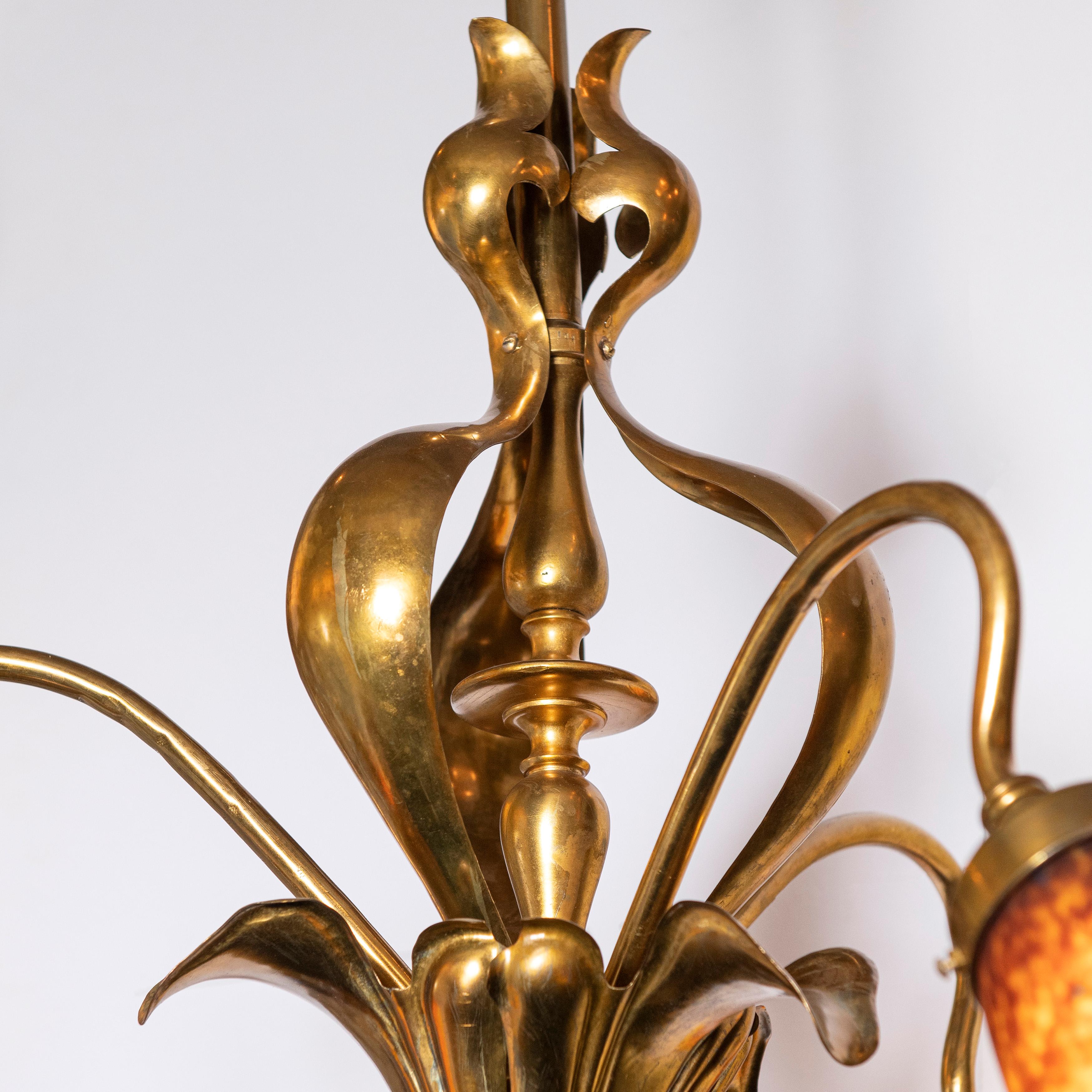Bronze and artistic glass chandelier, Art Nouveau style, France, early 20th century.
Schneider glass tulips.
Three lights.