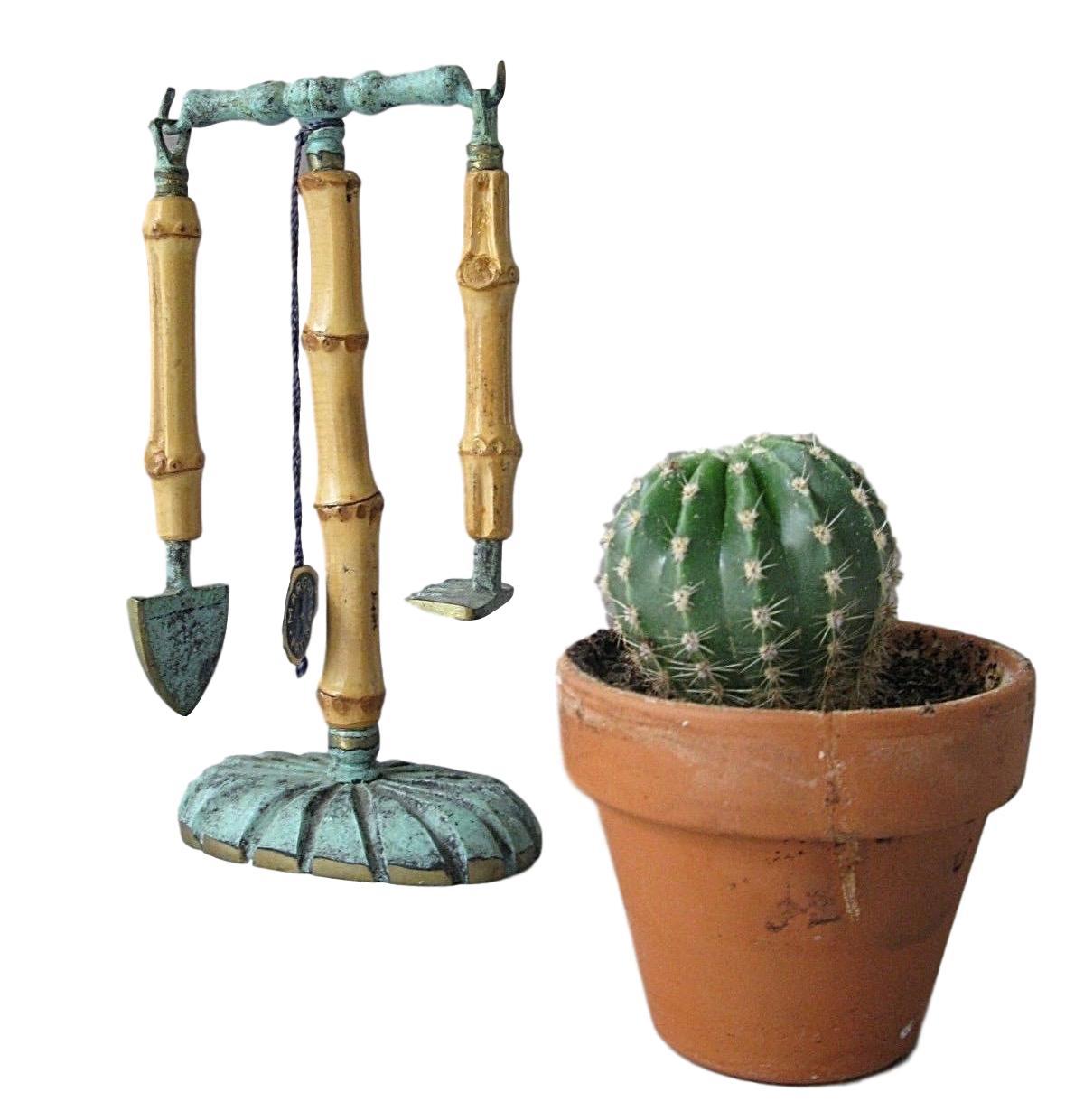A beautiful tool set from the 1950s. This unique object, is made of bronze with bamboo, was traditionally a cactus gardening tool set. A nice original midcentury item for displaying or just to use. It is in the original as found condition, i think
