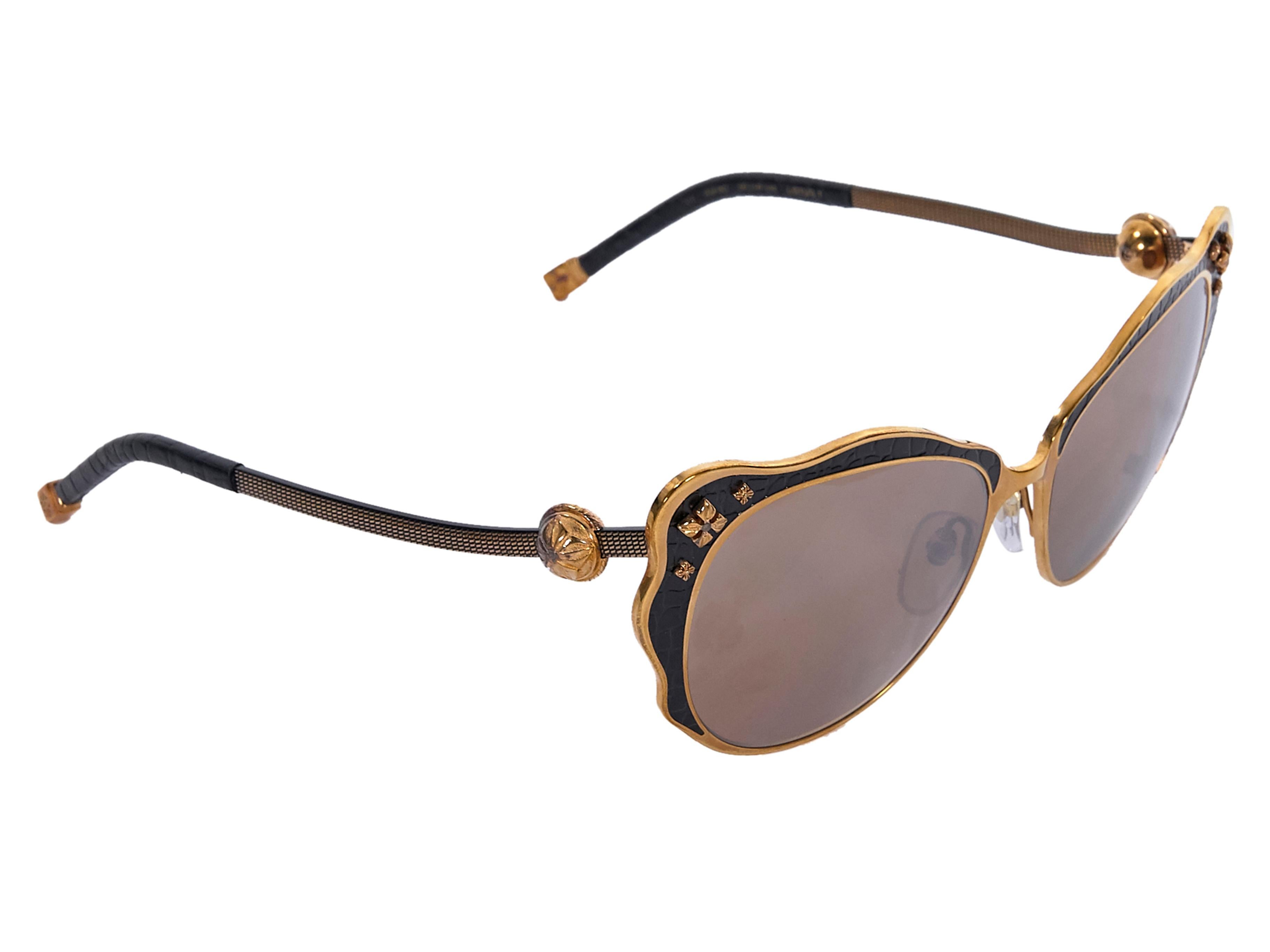 Product details:  Bronze and black-enamel Lotus 1 cat-eye sunglasses by Shamballa.  Brown gradient lenses. Cushioned nose pads. Embellished at front and stems. Partially leather-wrapped stems. Bronze-tone hardware. Wear with statement earrings.