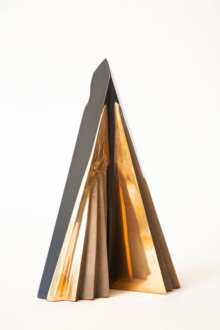 This fabulous vintage abstract signed Italian sculpture is Mid-Century Modern. It says on the label made in Italy and the signature is Esafedritolle. The bronze has 2 surfaces both professionally polished; one being textural and rough and the other