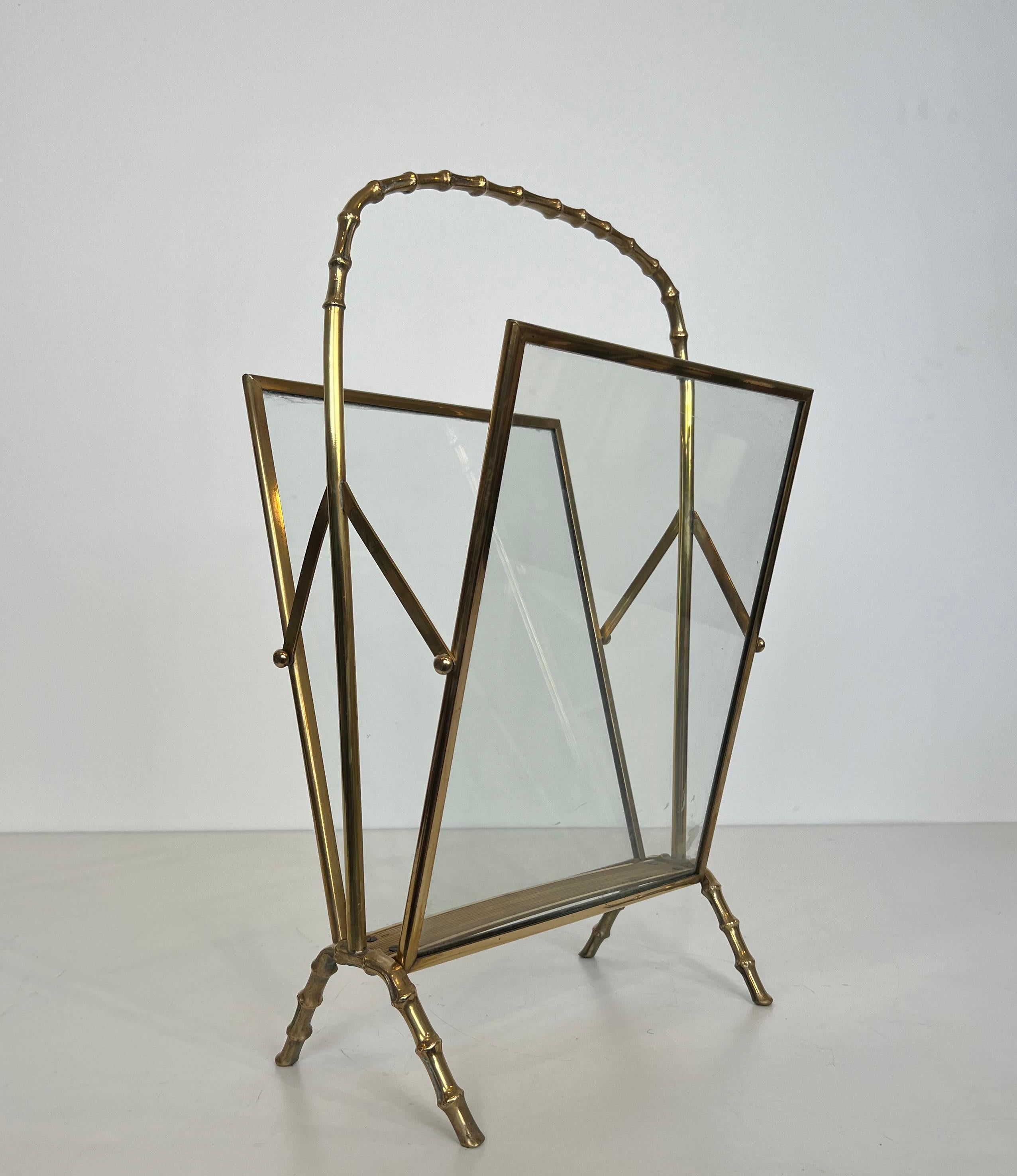 This very nice and elegant faux-bamboo magazine rack is made of bronze and brass with clear glass panels on each side. This is a Rrench work by famous designer Maison Baguès. Circa 1940