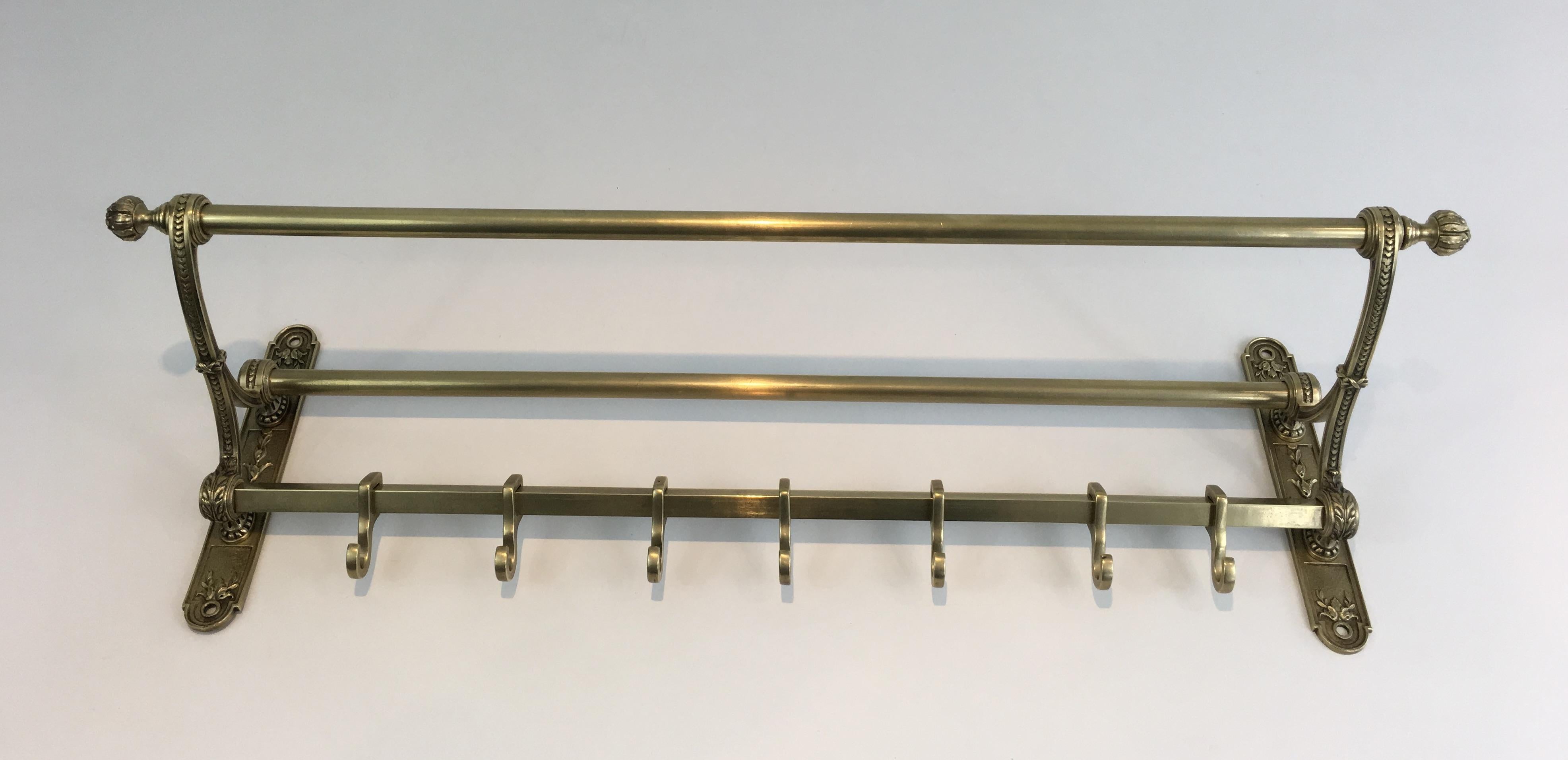 This beautiful neoclassical wall coat hanger is made of chiseled bronze and brass. This is a very nice model which quality is really good. This is a French work.