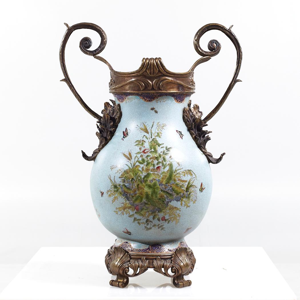 Bronze and Ceramic Light Blue Vase

This vase measures: 13.5 wide x 9 deep x 19 inches high

We take our photos in a controlled lighting studio to show as much detail as possible. We do not Photoshop out blemishes.

Most of our decor items ship