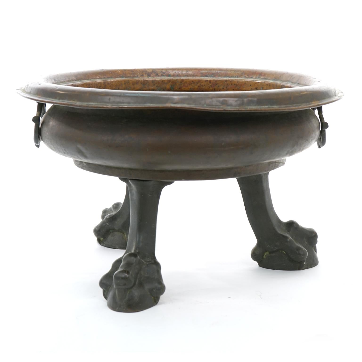 Straits Chinese, copper and bronze, circa 1820s. This fabulous planter is perfect as a centerpiece or lined and pressed into service as a wine cooler. At 14 inches tall and 23 inches in diameter, it is an impressive size. The bowl is hand worked