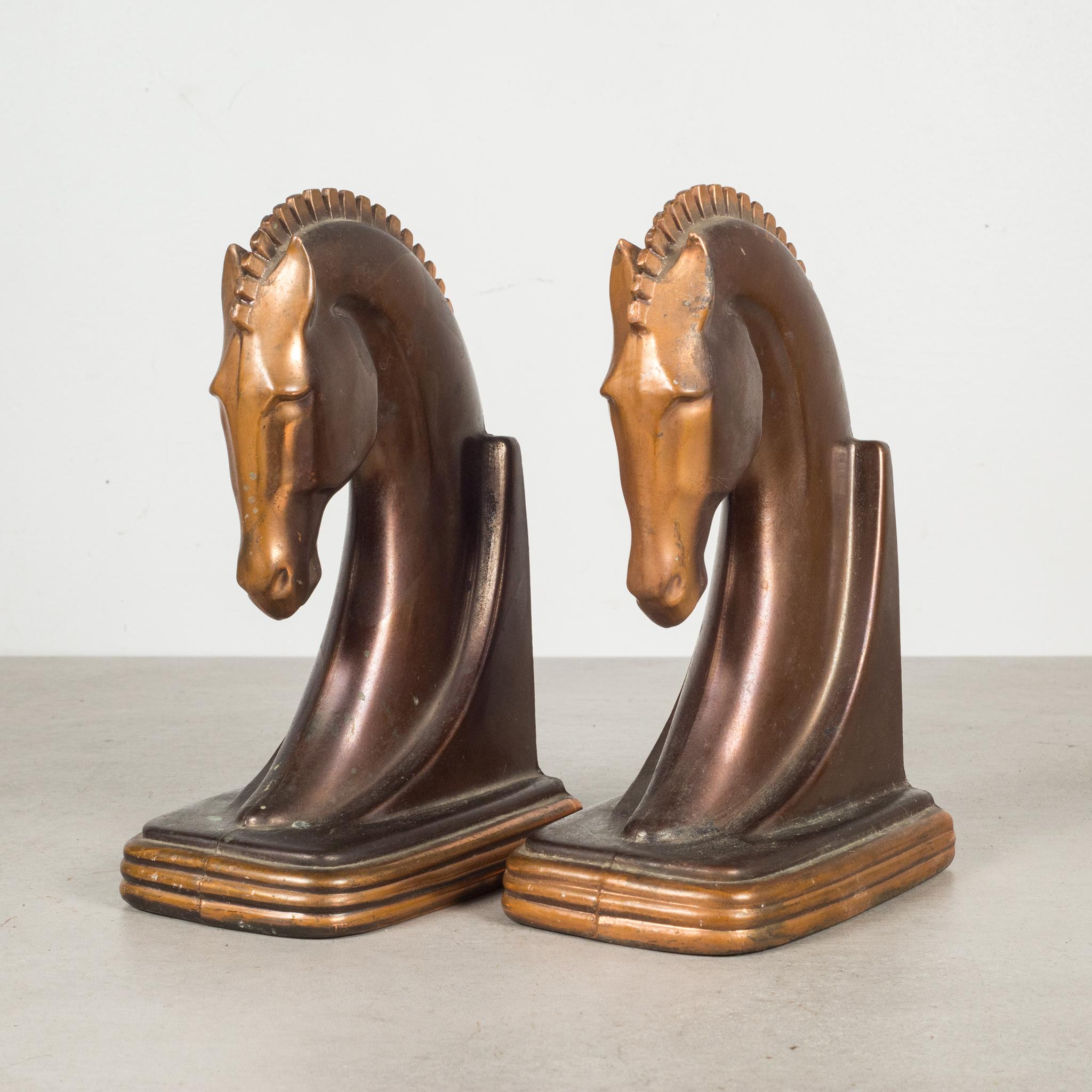 About

An original pair of Art Deco cast metal Trojan horse bookends manufactured by Dodge Trophy Inc. Los Angeles California USA. Both pieces have retained their original bronze and copper finish and are in good condition with appropriate patina