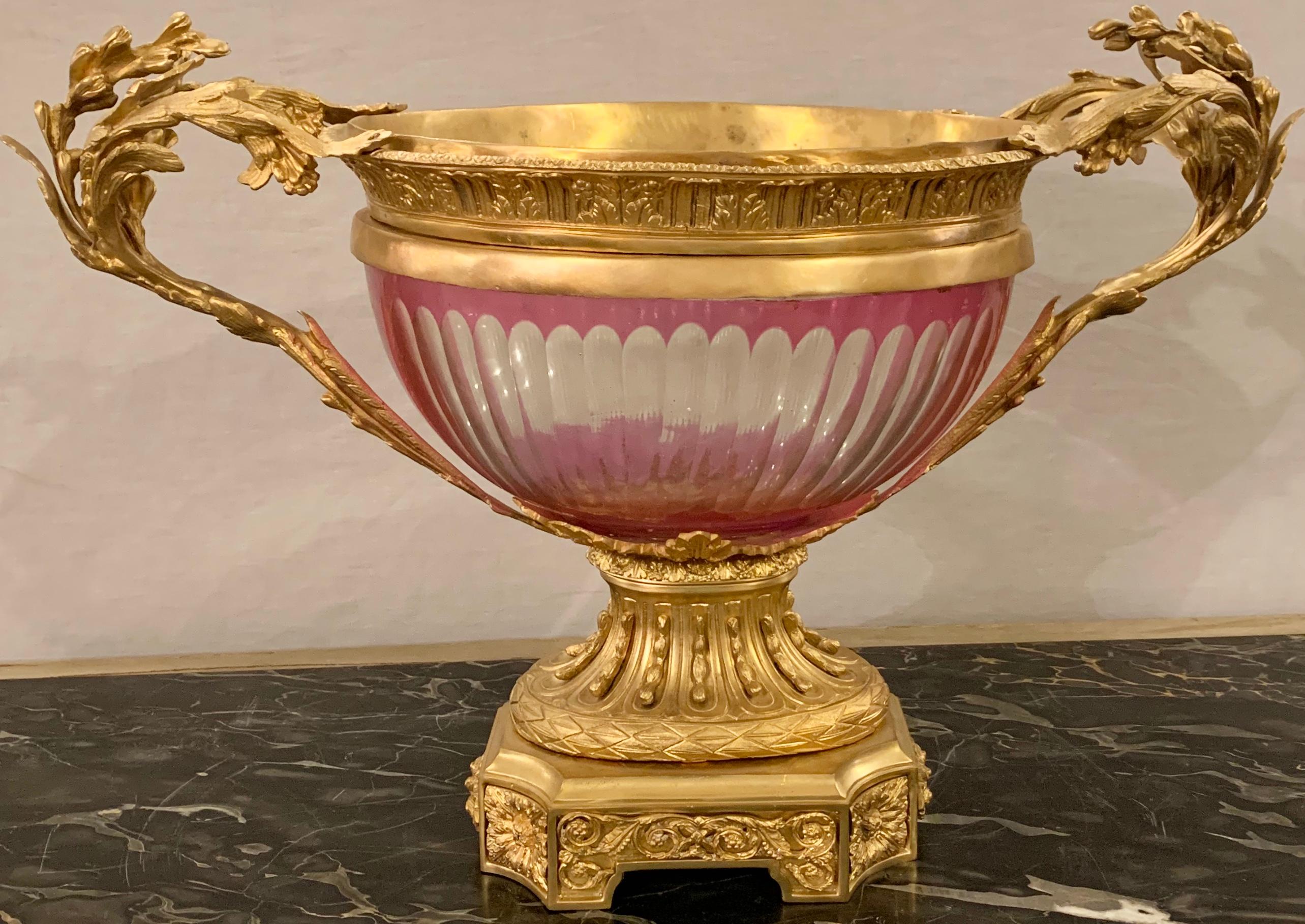 Bronze and crystal centerpiece, flower pot or compote. The bronze gilt metal frame holding a lavender cut to clear crystal pot.

Greg
EXAX/22XA.