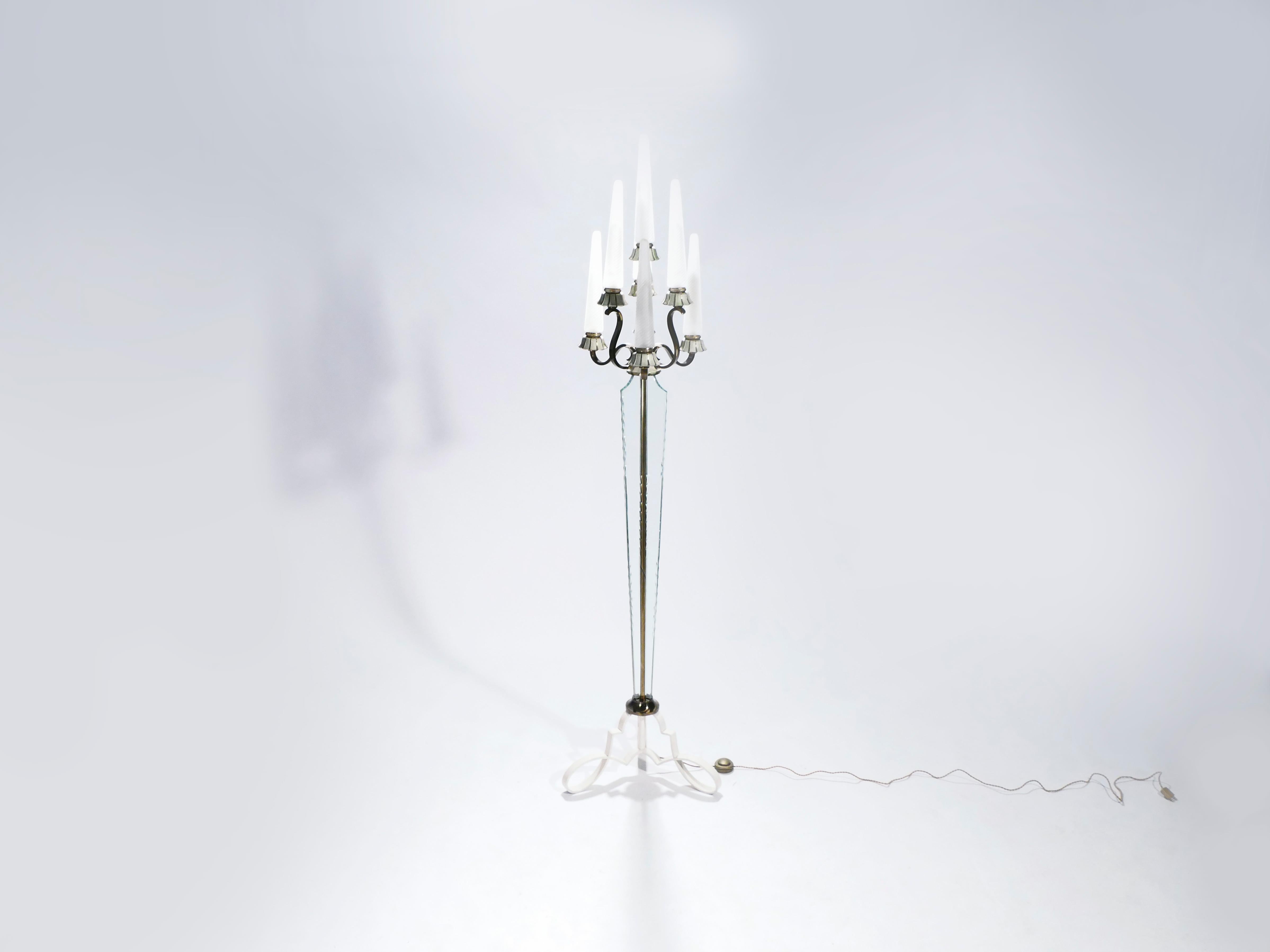 The craftsmanship of lighting designer Marius-Ernest Sabino and the crystal quality of la Cristallerie de Sèvres have come together in this unique Art Deco floor lamp. Bronze and iron form its formidable, vertical structure that draws the eye