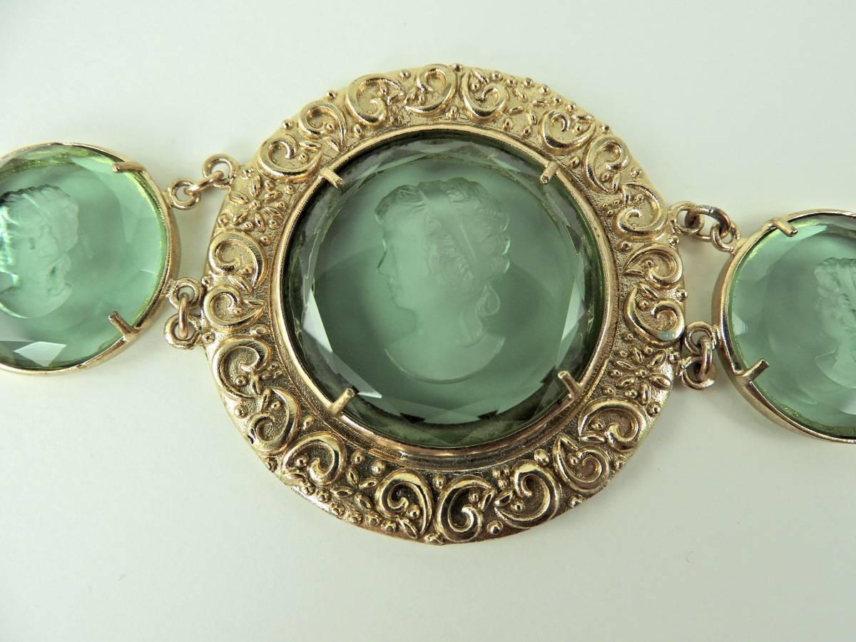 Bronze and green Murano glass bracelet from the Frames collection. Murano Glass piece has been cut by an expert craftman, the engraving  in the glasses depict a woman's head. Bracelet is handmade in Florence by goldsmith craftman and marked Patrizia