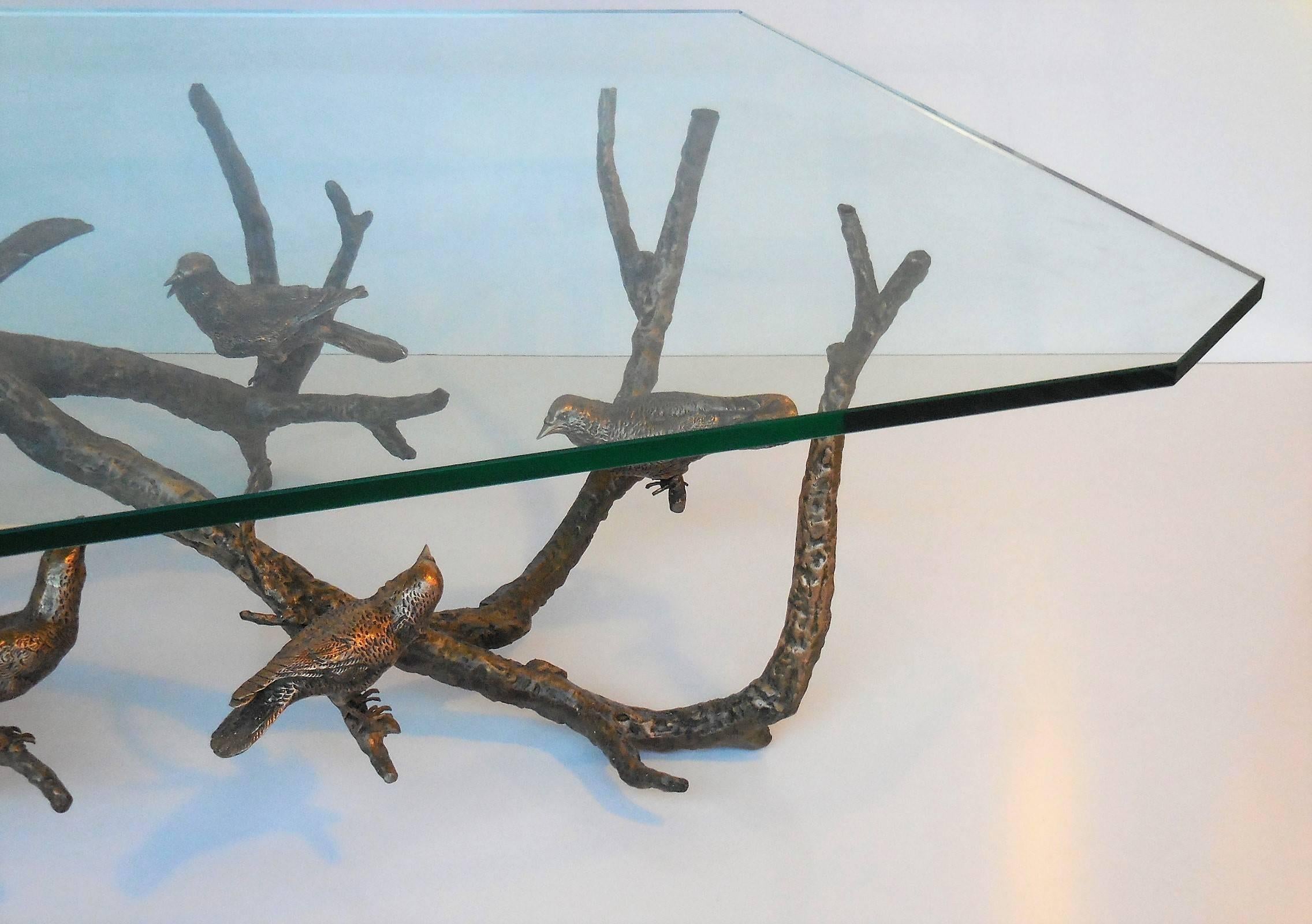 faceted metal coffee table with glass top