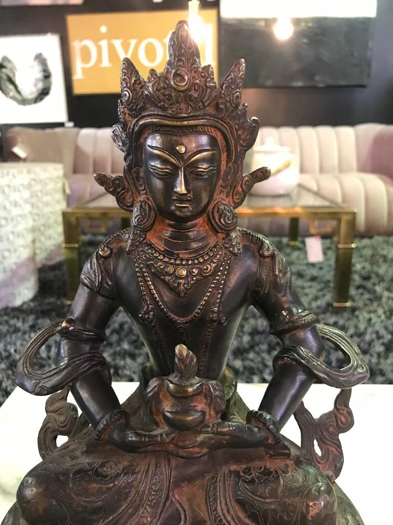 This is a fantastic piece. Perhaps part of a Tibetan temple shrine at one time. Beautiful faded gilt coloring and patina. We believe this is the Tibeat figure of the white Tara, the goddess of great compassion. She is akin to the Chinese figure of